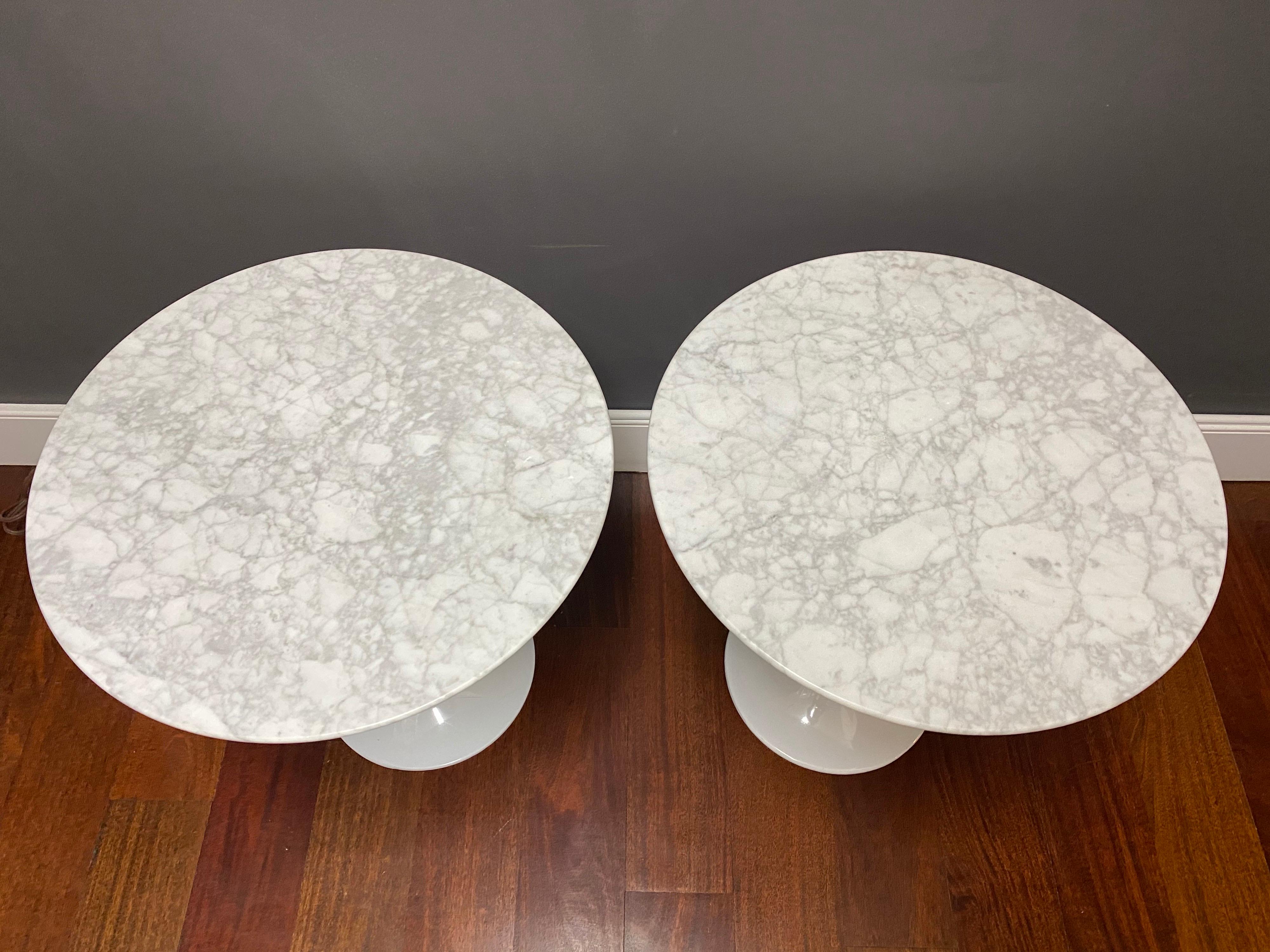 A pair of quality Saarinen style tulip side tables with marble tops.