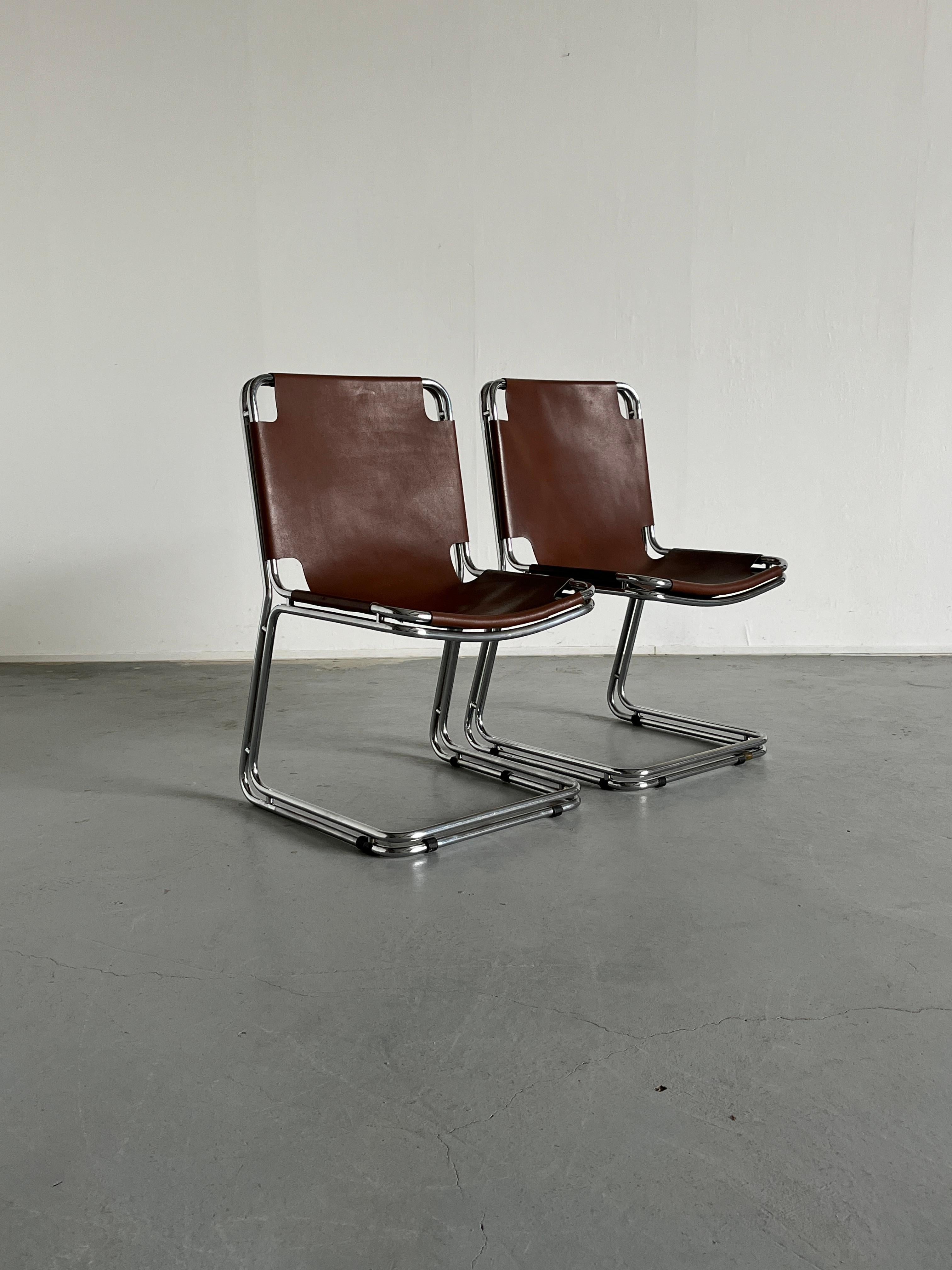 Pair of vintage Italian cantilever chairs made from a chromed metal base and saddle leather one-piece seating. In the style of Pascal Mourgue or Gastone Rinaldi.
High-quality Italian production of the 1980s.

Very good vintage condition with