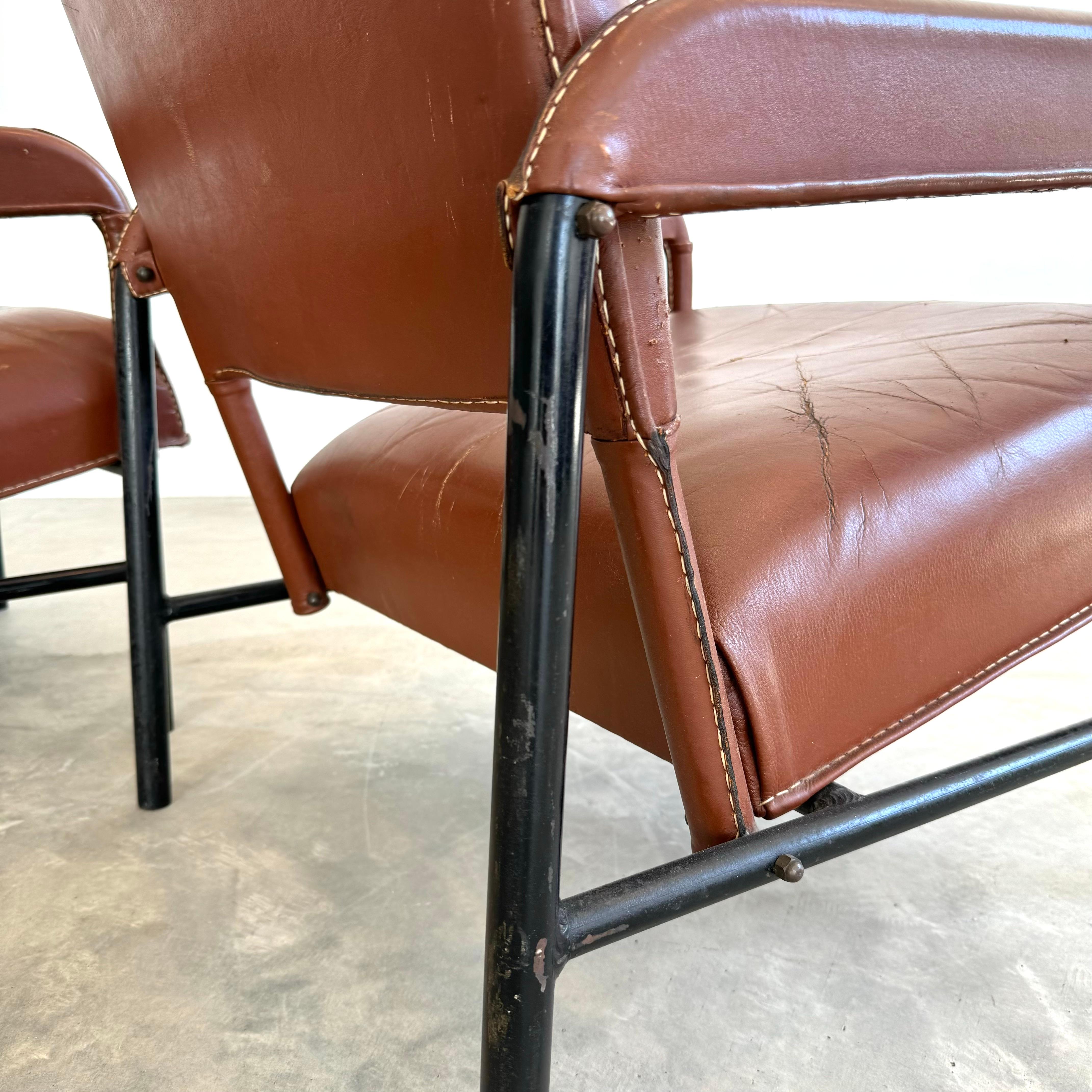 Mid-20th Century Pair of Saddle Leather and Iron Armchairs by Jacques Adnet, 1950s France For Sale