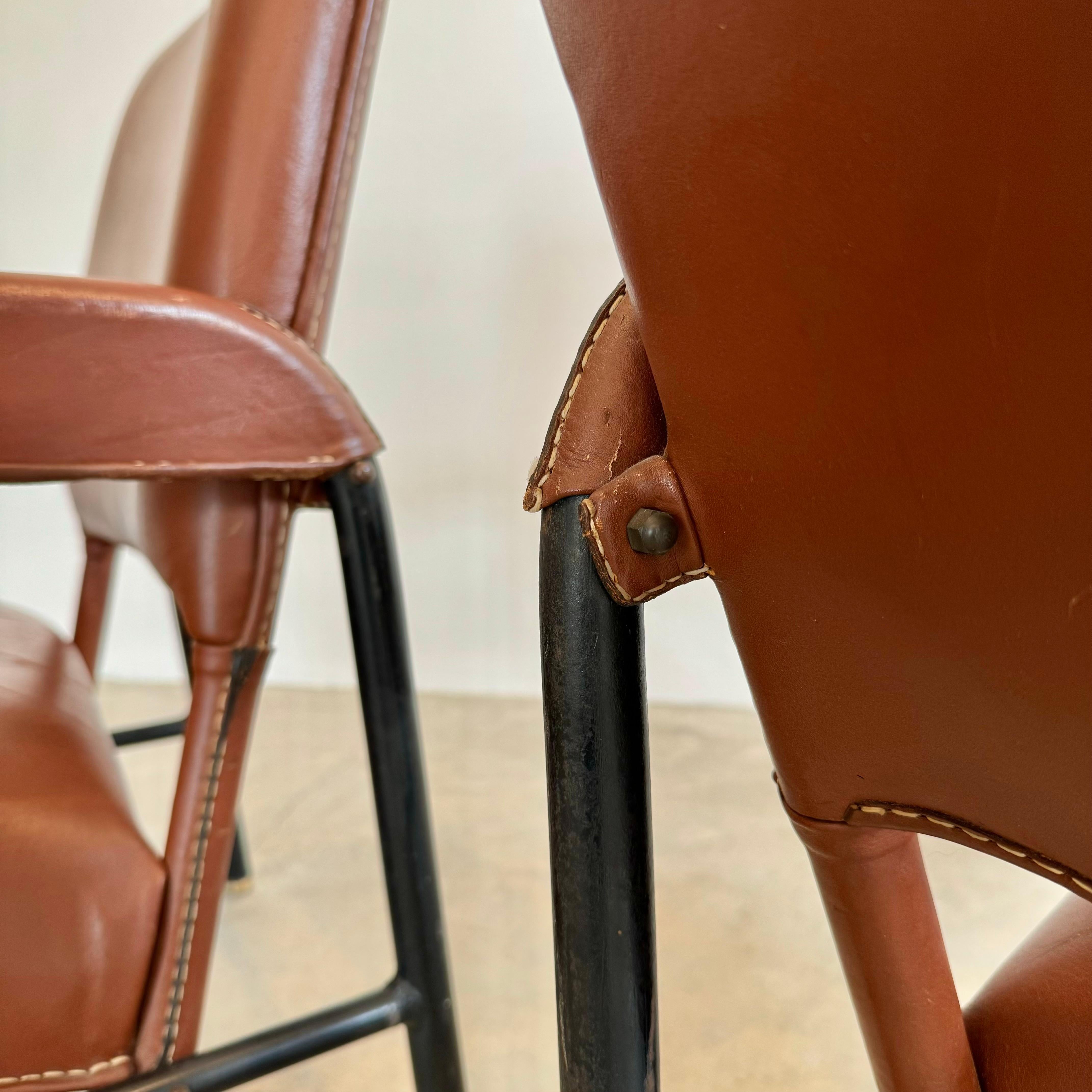 Brass Pair of Saddle Leather and Iron Armchairs by Jacques Adnet, 1950s France For Sale