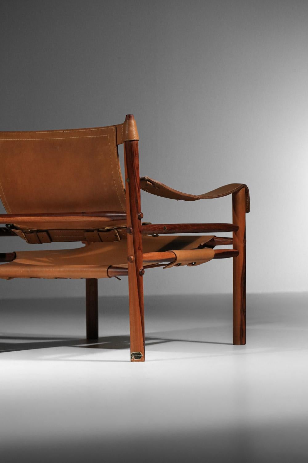 Pair of safari armchairs by Arne Norell in patinated leather and solid wood 4