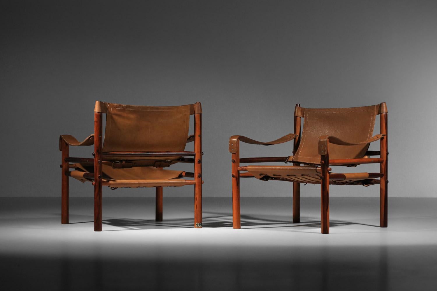 Pair of safari armchairs by Arne Norell in patinated leather and solid wood 9