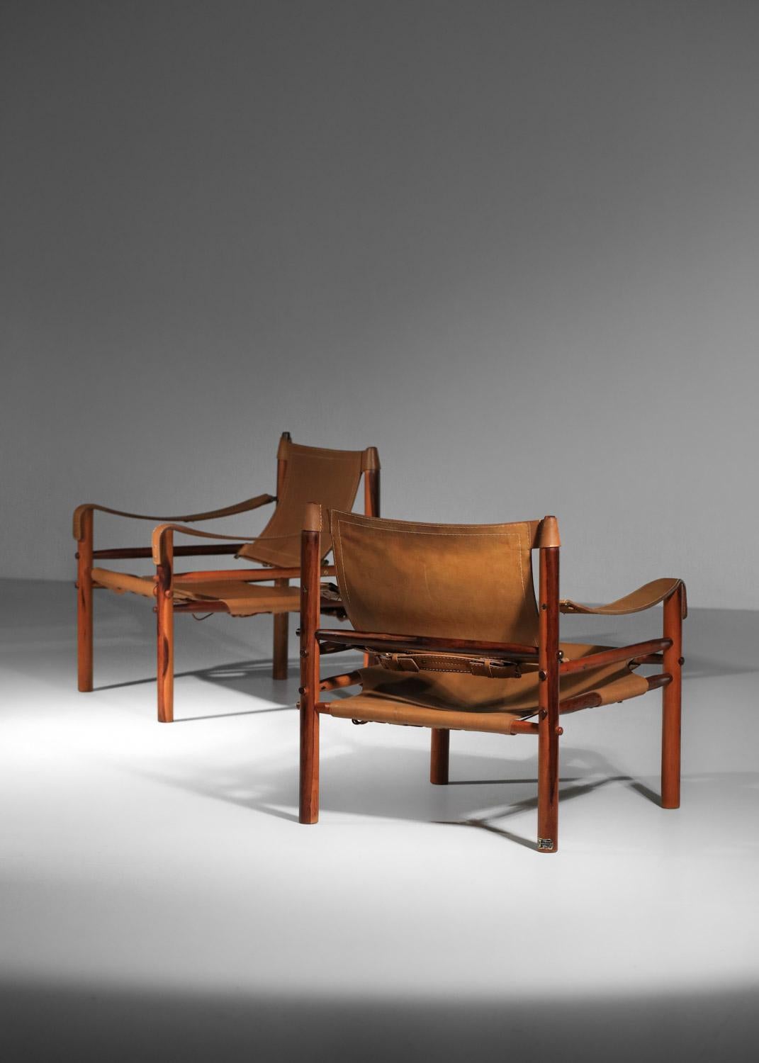 Pair of safari armchairs by Arne Norell in patinated leather and solid wood 11