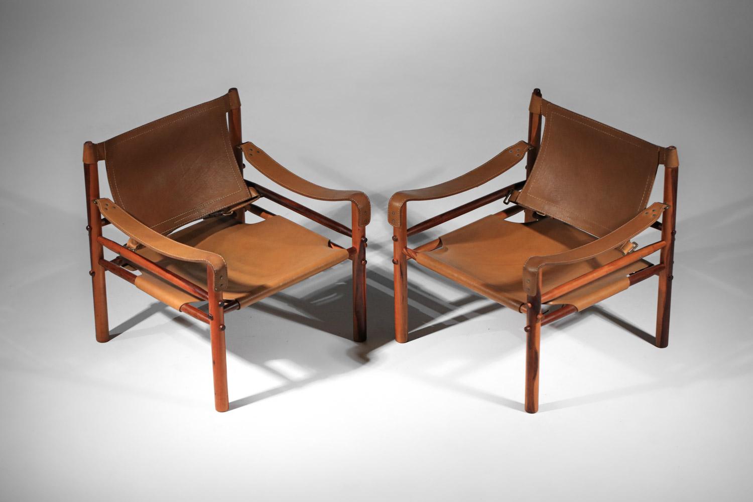 Leather Pair of safari armchairs by Arne Norell in patinated leather and solid wood
