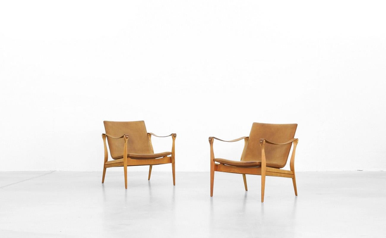 Very beautiful pair of lounge chairs by Karen & Ebbe Clemmensen for Fritz Hansen in the 1960s. 
The chairs were beautifully reupholstered and are in excellent condition.
 