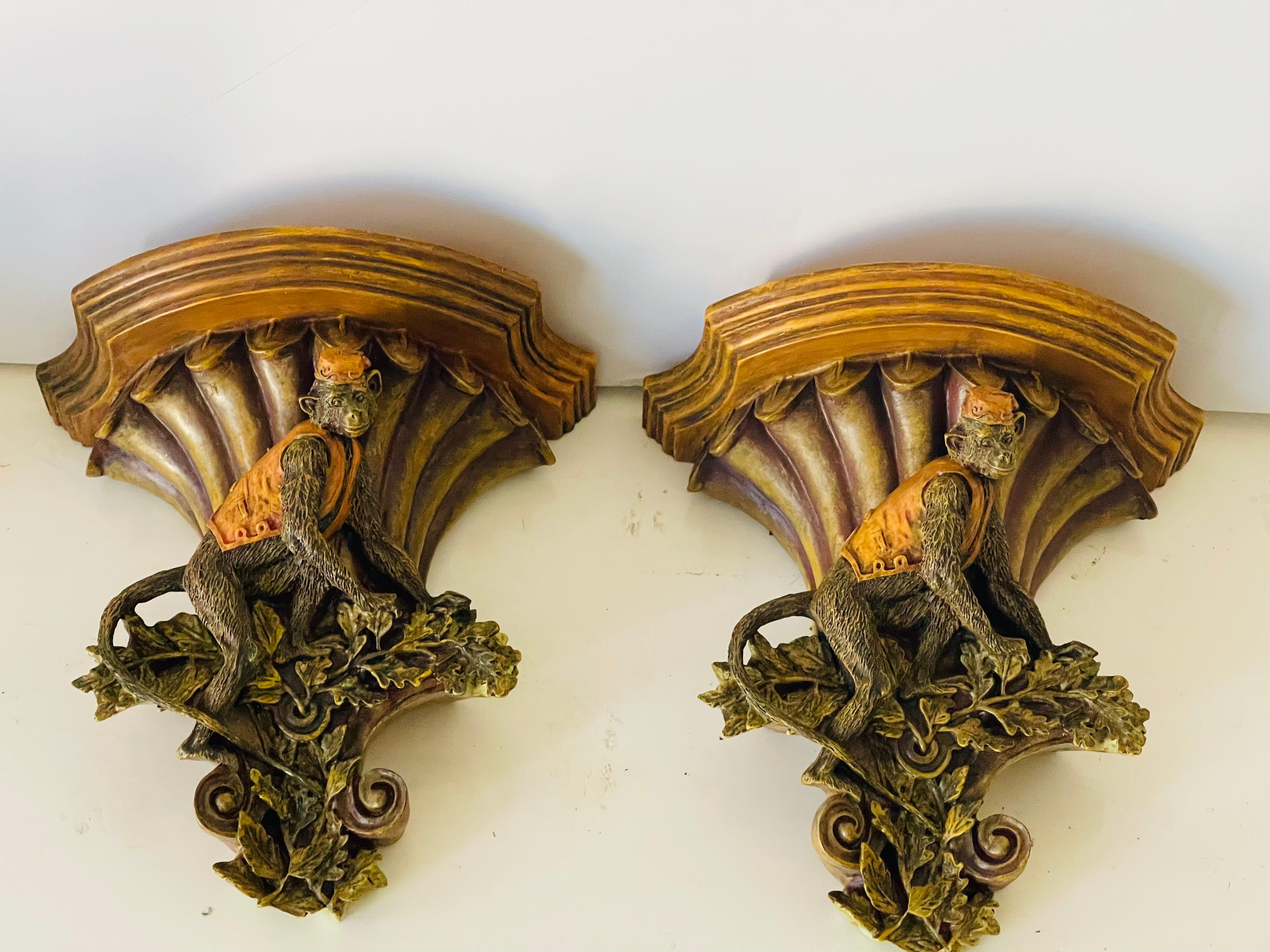 Safari style pair of composition brackets with monkey figurines. 