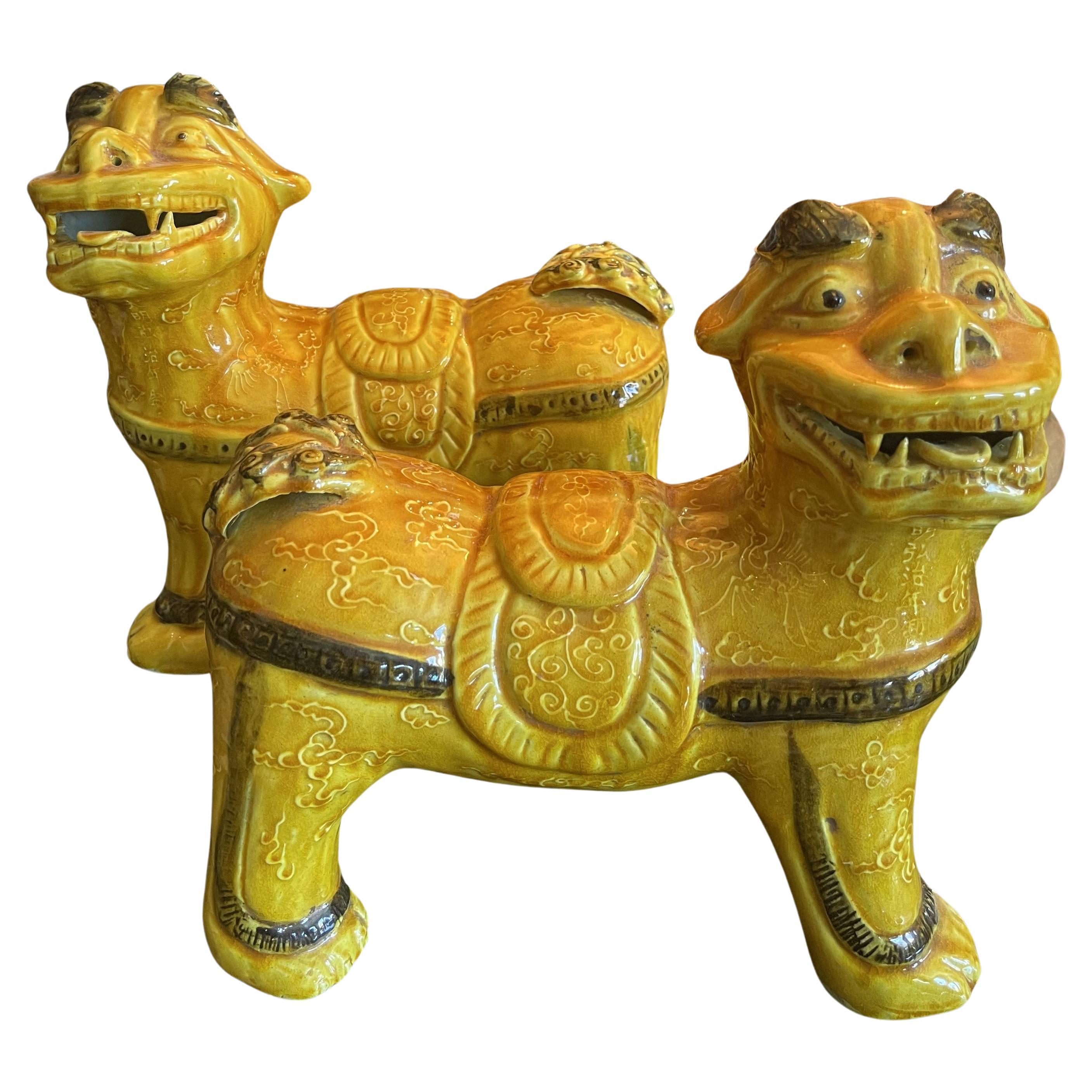Pair of Saffron and Green Glazed Foo Dogs