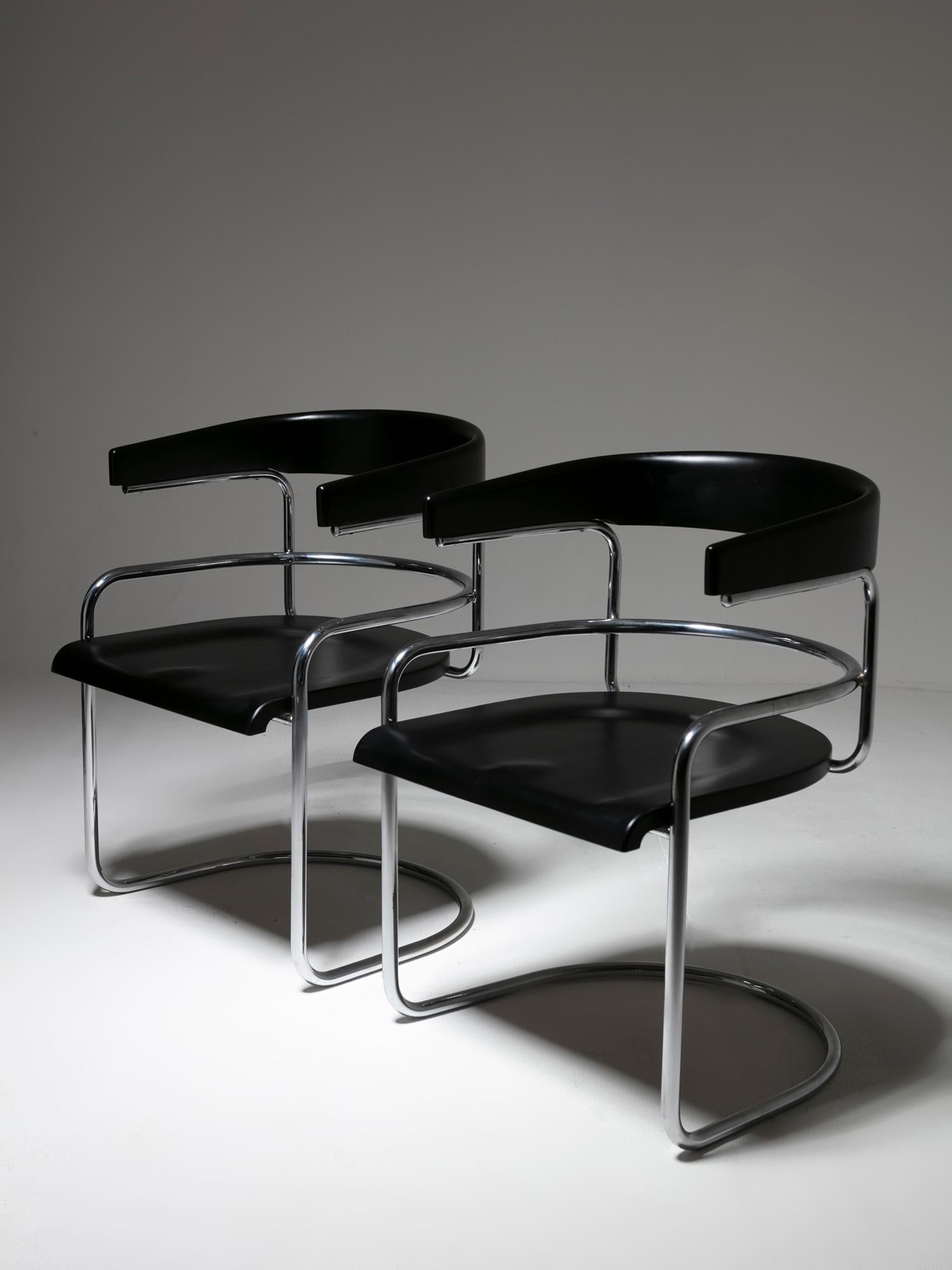 Rare set of two Saga armchairs by Ennio Chiggio for Nikol Internazionale.
Chrome frame supports black wood seat and back rests.
An intriguing work connected to 1920s shapes.