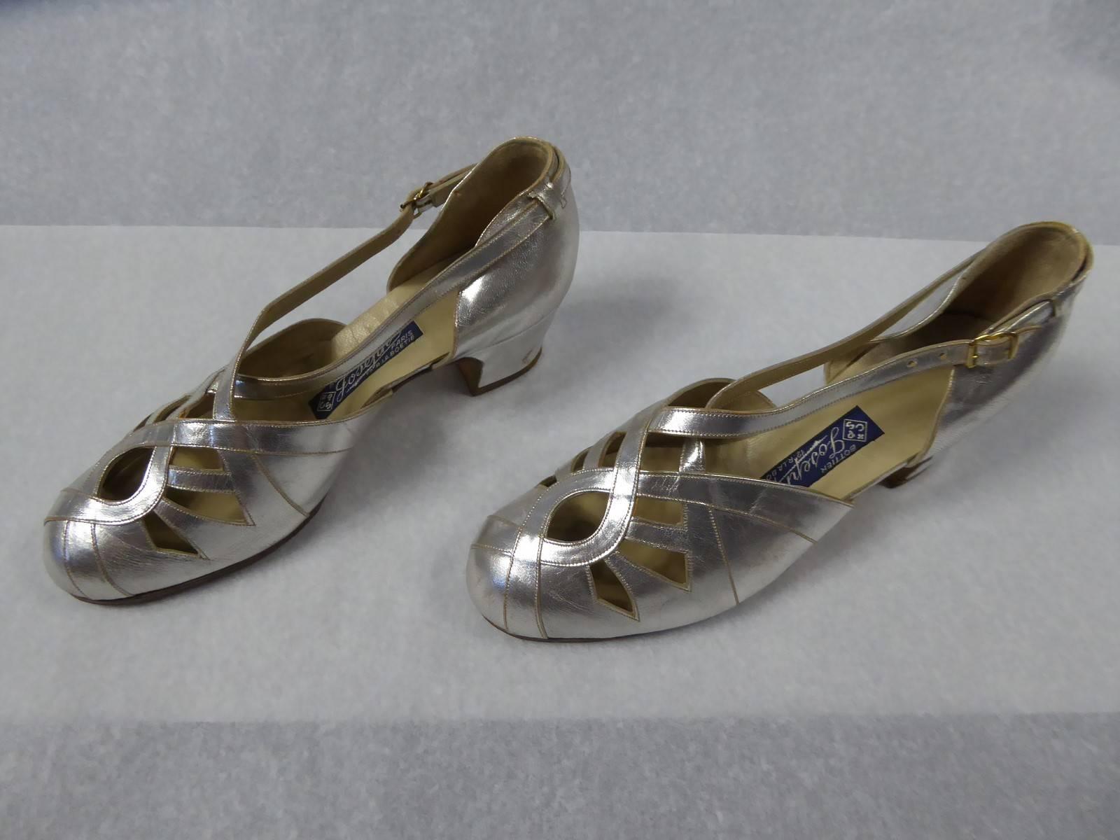 Circa 1930/1940

France

A pair of Salomé shoes in cream and silver leather from the 1930/1940. The work of a parisian bootmaker, tag saying CPS Bottier Joseph, Paris 12 rue La Boétie. Openwork effect on the top, finished by a strap and buckle at