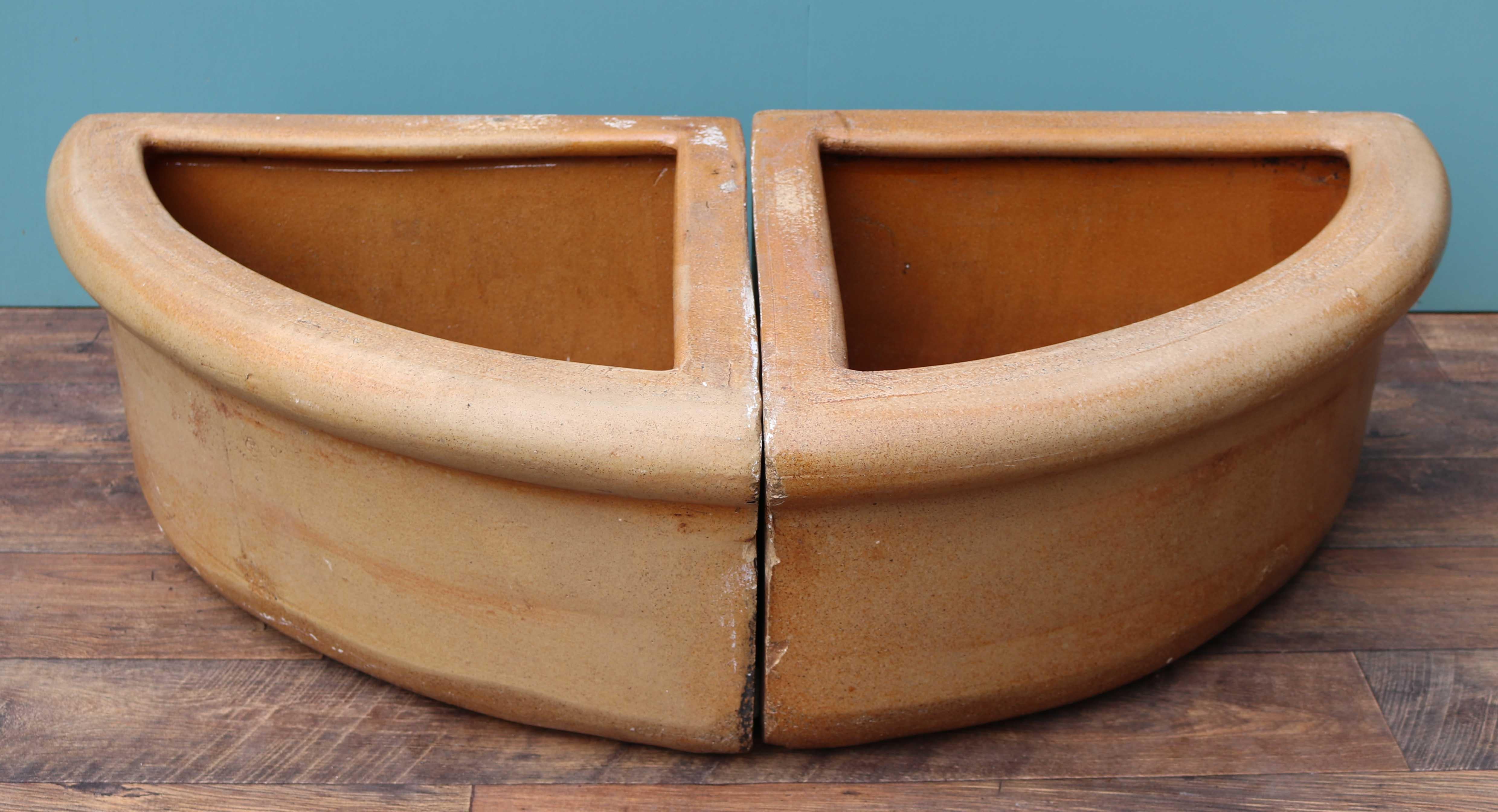 A matching pair of reclaimed antique salt-glazed corner troughs. Reclaimed from a stables in Norfolk.
 
Additional Dimensions:
 
Back edge width 62 cm
 
Back edge depth 62 cm