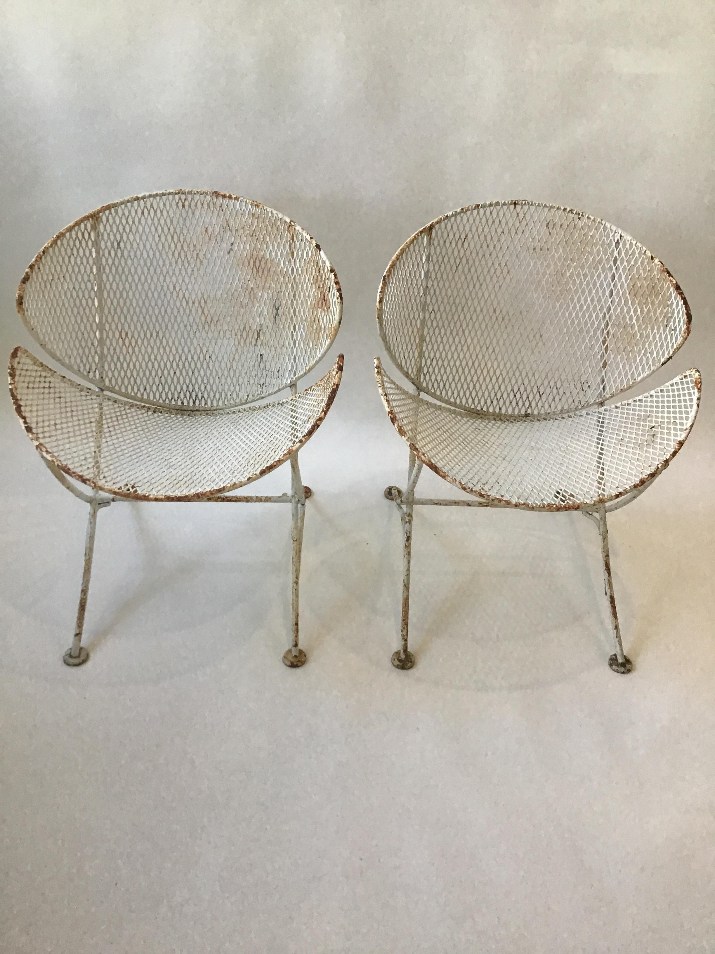 Pair of Salterini clam shell chairs. Needs to be repainted.