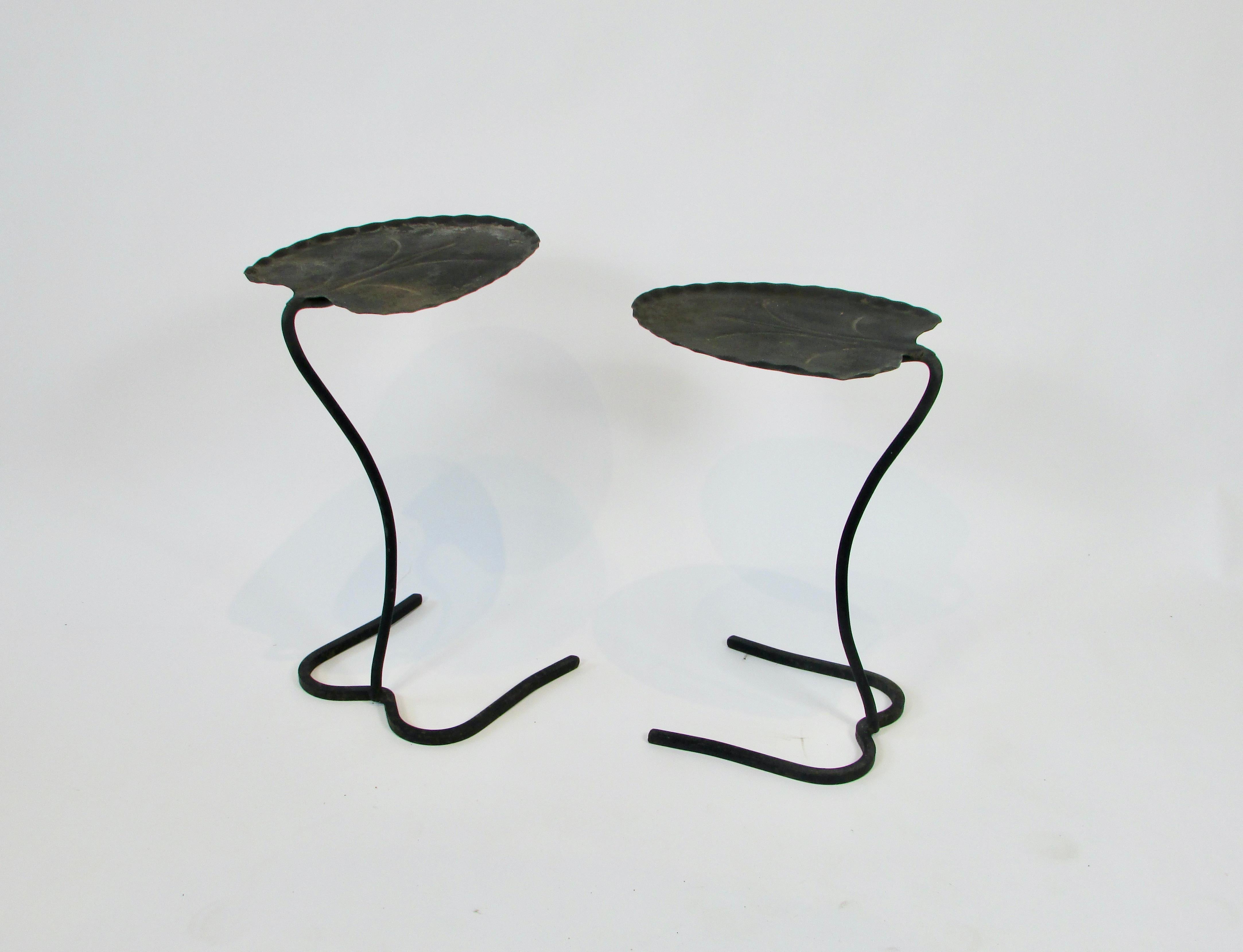 Pair of Salterini occasional table . Sheet metal table top formed to resemble lily pad leaf . Top is welded to square stock base giving the table a sculptural animal like feel . Shown in older original finish . Taller table at 20.5