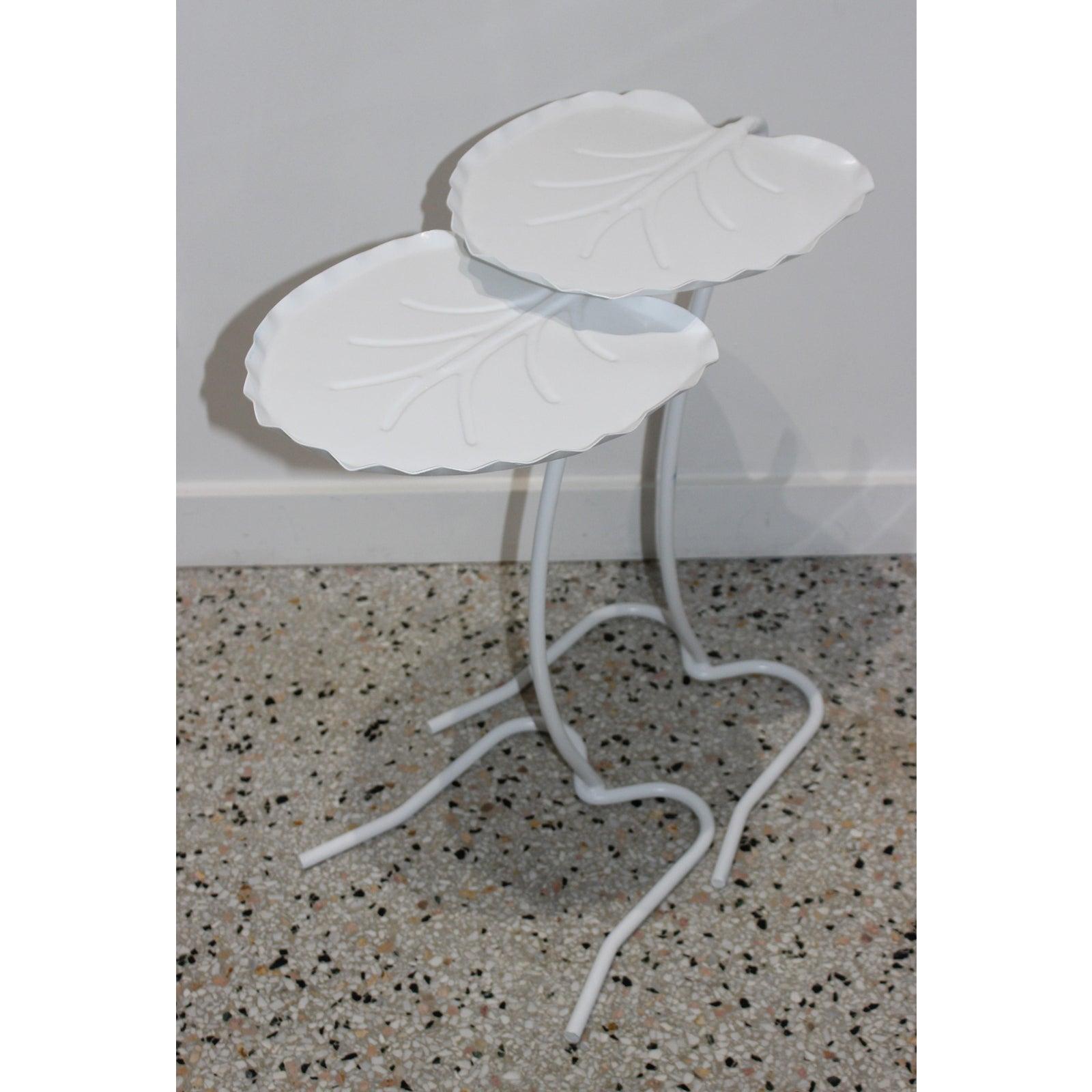 Salterini nesting lily pad drinks tables indoor outdoor patio - set of two from a Palm Beach estate.

Refinished and freshly painted white.

Note: We have two additional sets of two available on the 1stdibs platform.

Measures: Taller table: 22.5 H