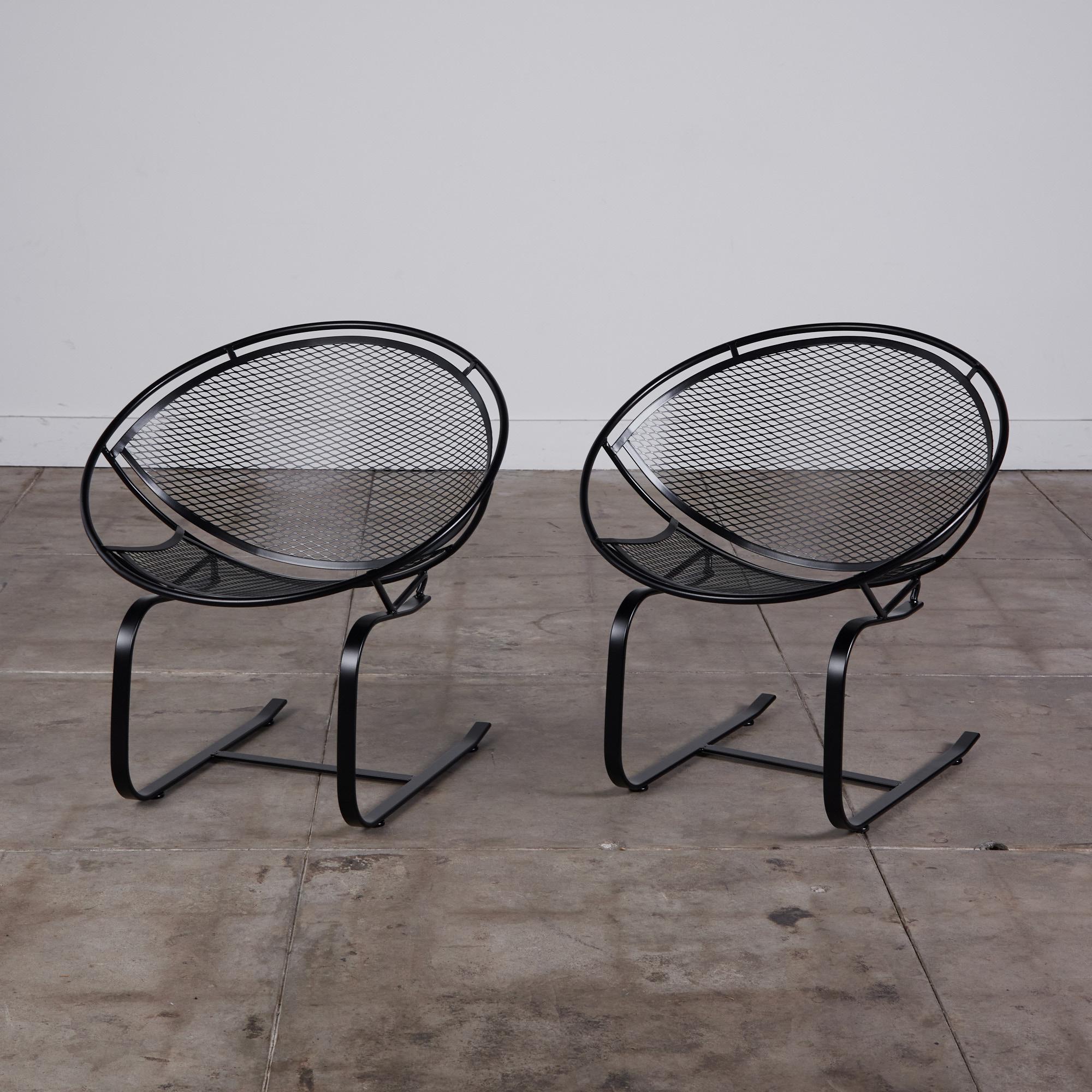 Wrought iron rocking chairs from Maurizio Tempestini's 1950s “Radar” collection for John Salterini. The chairs have a hoop construction with a delicate grid of wrought iron forming the body and a cantilevered spring base.

Dimensions: 30” width x