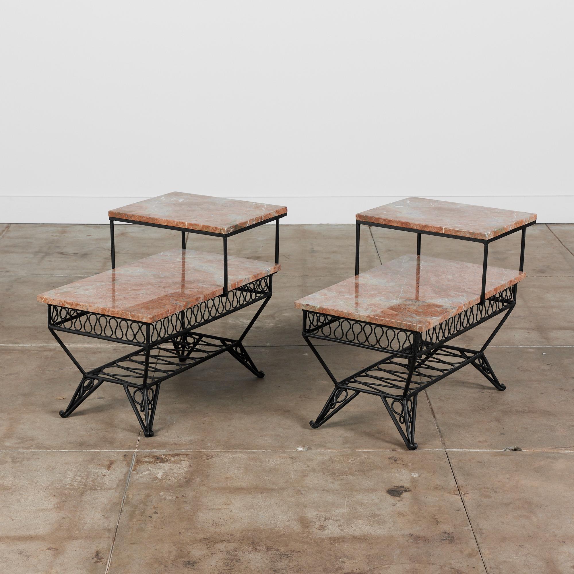 Side tables in the style of Maurizio Tempestini for John Salterini, USA, circa 1950s. The rectangular two tier side tables feature Tempestini's ribbon style detailing under the base of the table tops. The tables have been newly powdered coated in a