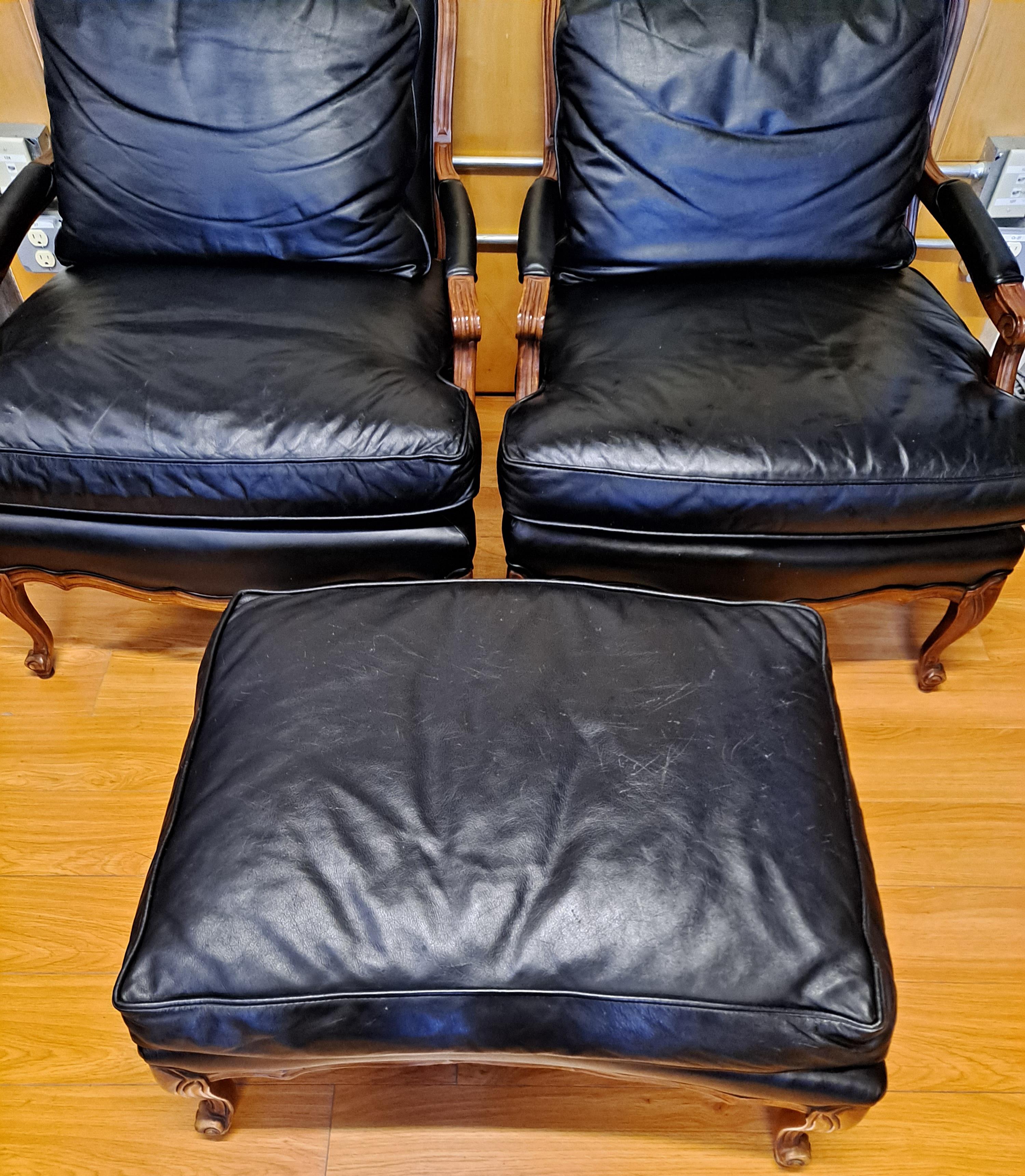 Pair of Sam Moore leather bergere-arm chairs with matching ottoman

28.5 x 20.5 x 17