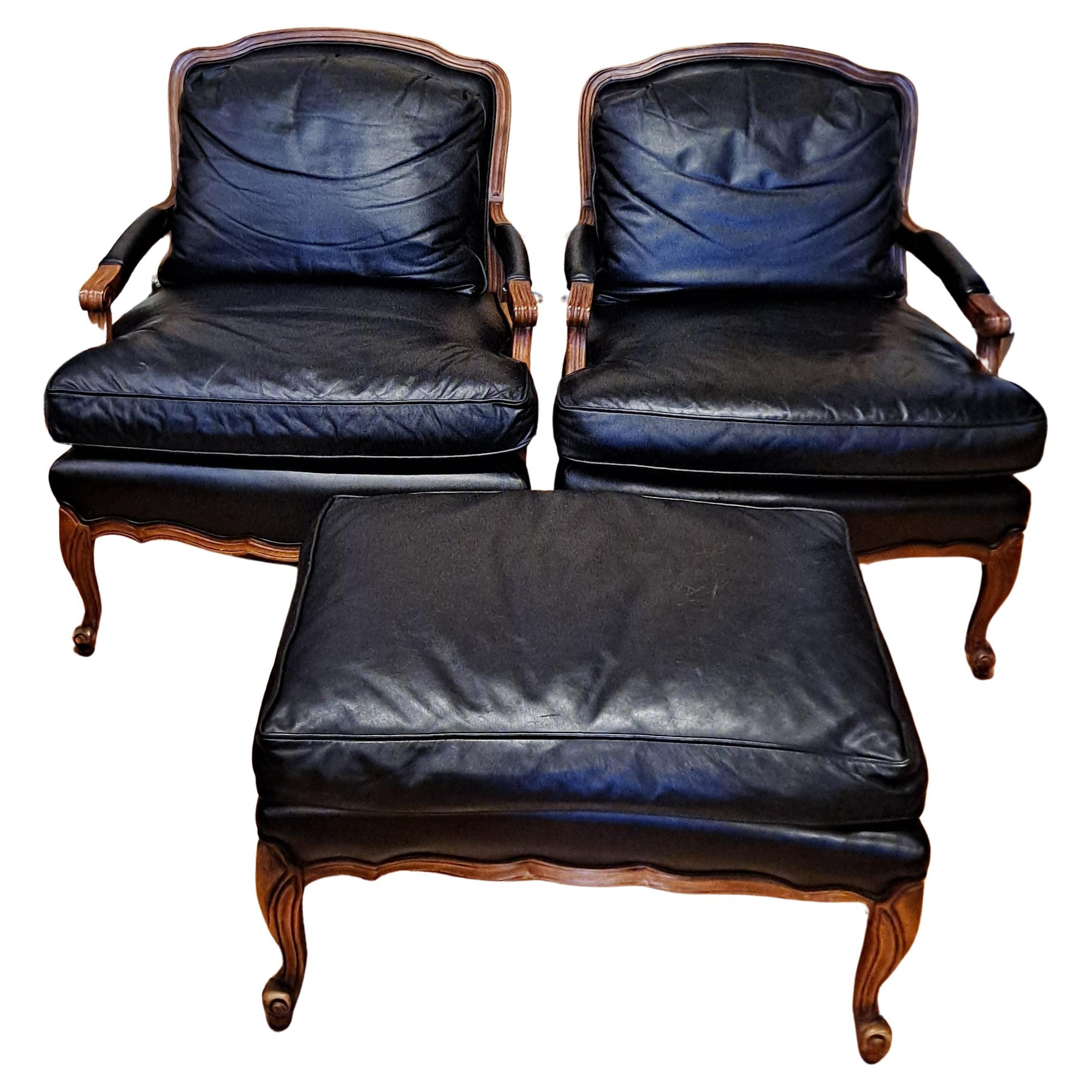 Pair of Sam Moore leather bergere-arm chairs with matching ottoman For Sale