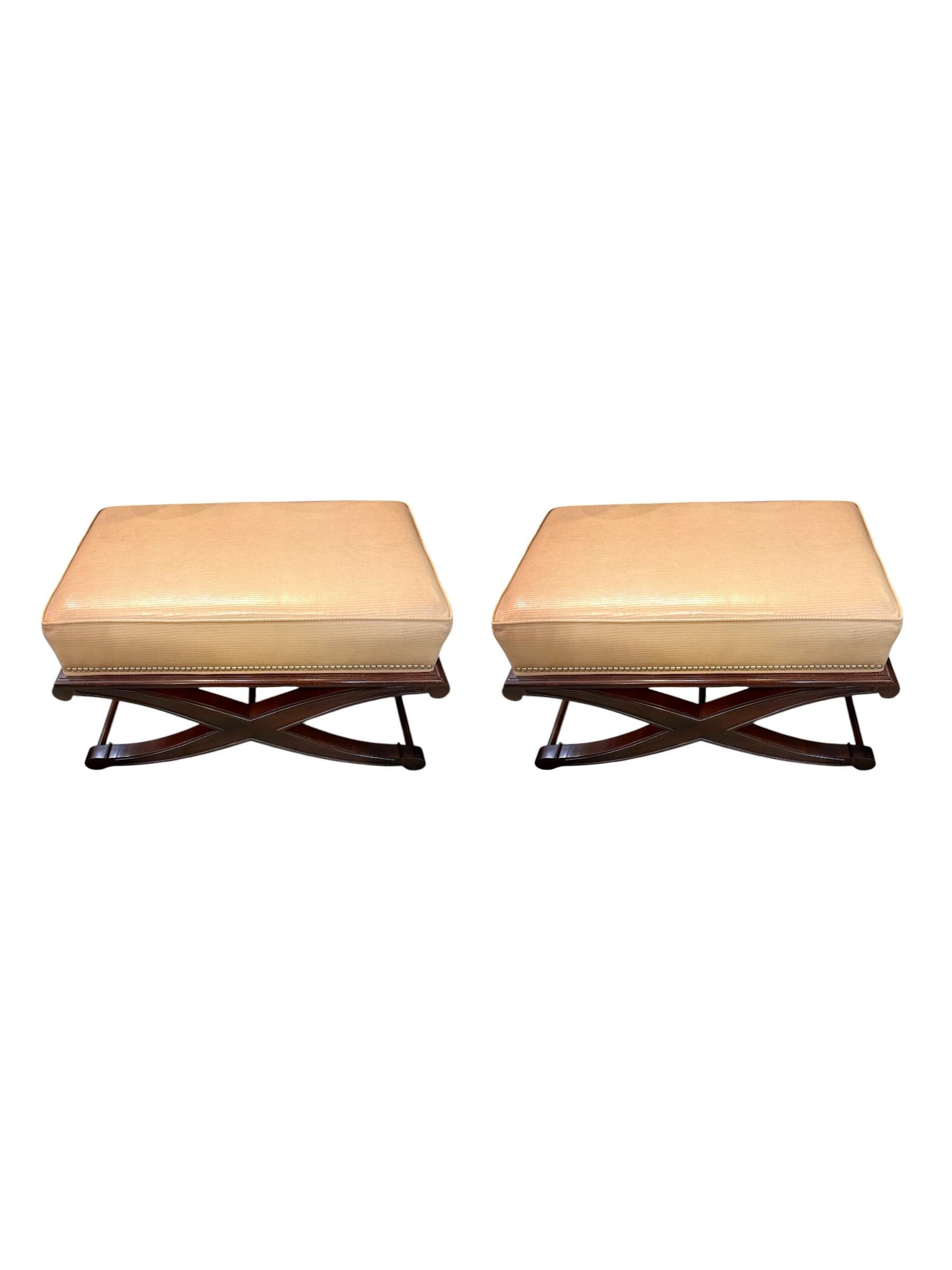Elevate your living space with the elegant charm of these Sam Moore Leather Beige Ottomans. Crafted with timeless style in mind, this pair of ottomans features a rich, neutral beige leather upholstery that adds sophistication while complementing a