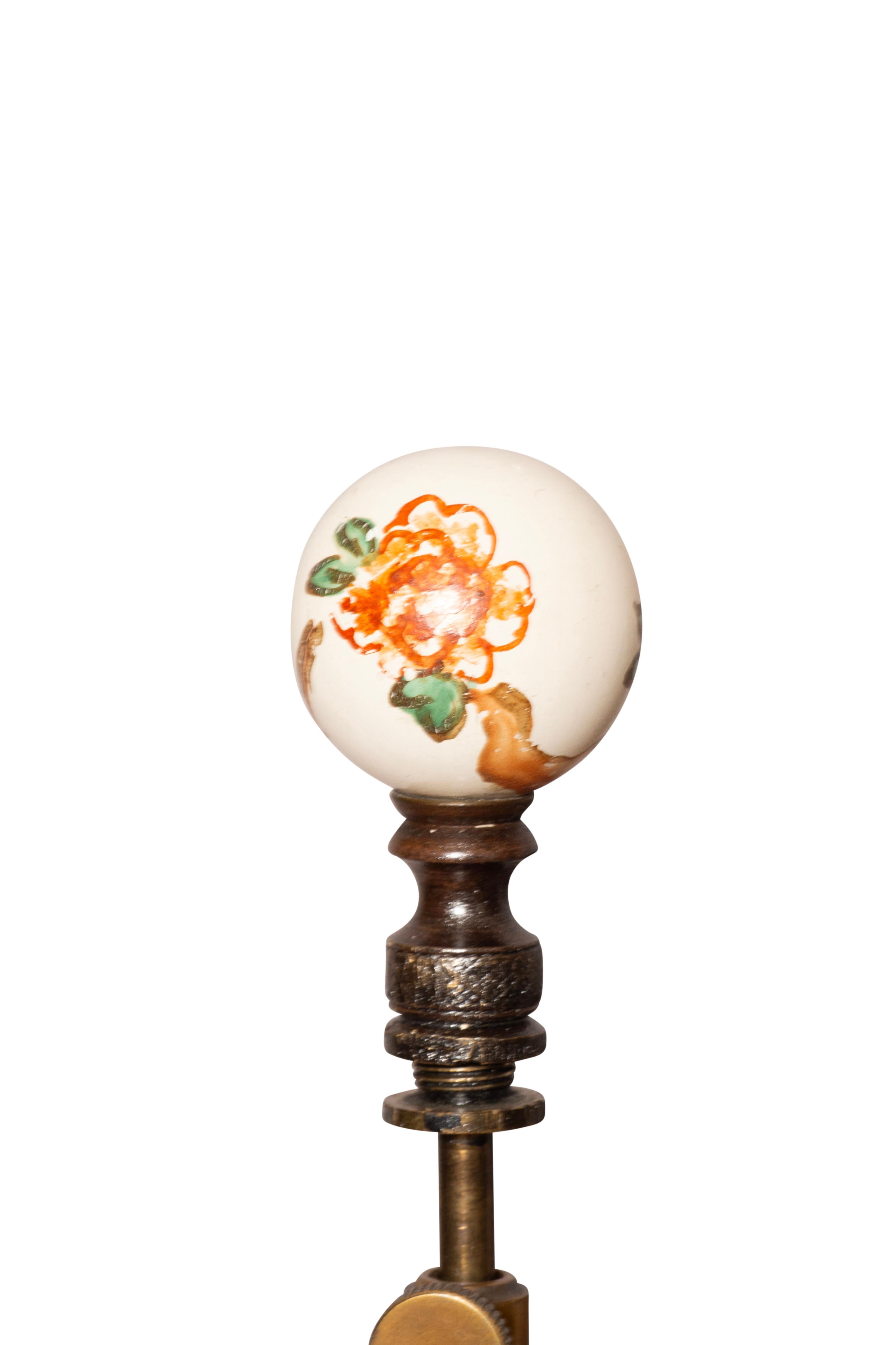 Interesting lamps with a central porcelain ginger jar with prunus decoration with cover with a carved and painted wood base to match and blend with the porcelain. An extender between the cover and the top of the vase. Someone went to lots of trouble
