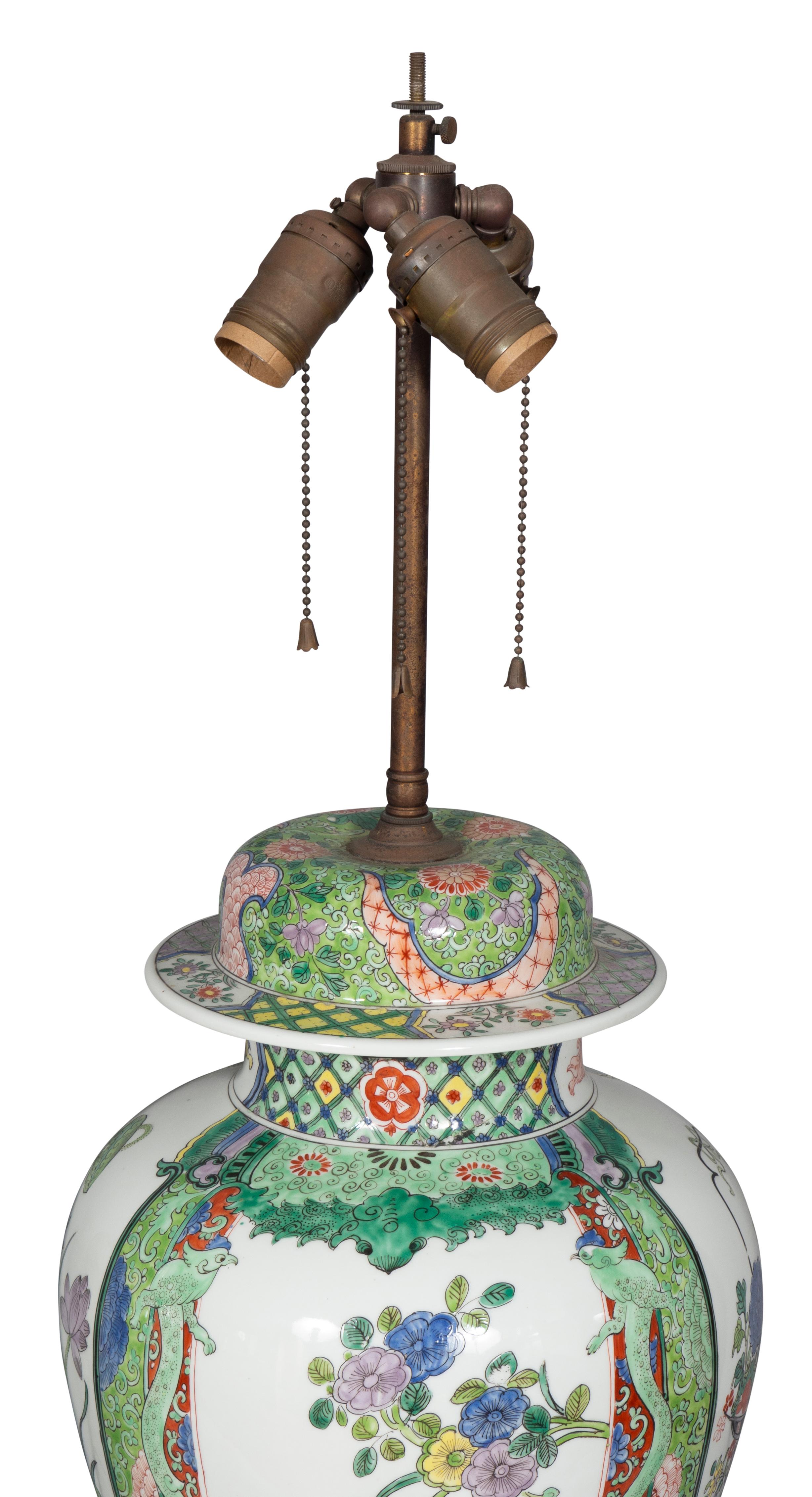 Large scale. Now lamps with domed cover and baluster form body with bronze mounted cover and base. Decorated with aubergine, yellows and greens in the oriental taste. Dick collection Bellevue Ave Newport RI.