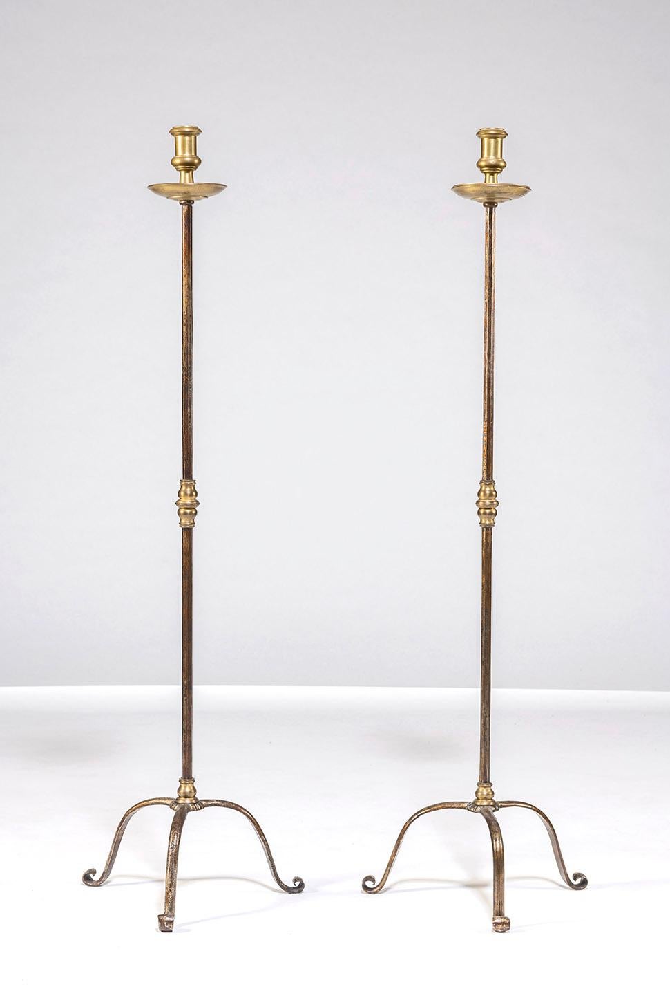 Pair of wrought iron and brass floor standing candle stands by American blacksmith Samuel Yellin circa 1920s. Impressed mark 