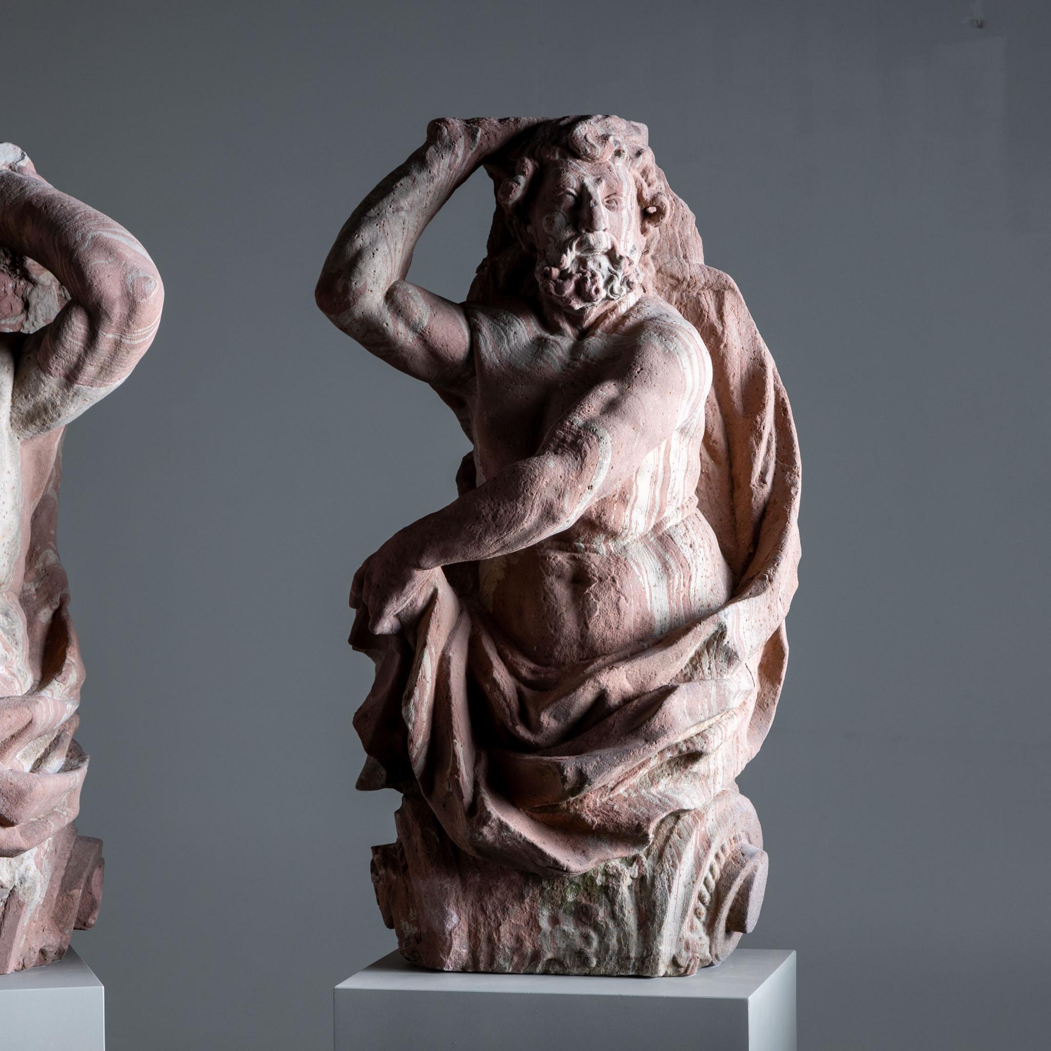 A pair of monumental atlases made of marbled sandstone from the Main-Franconia region. Formerly part of the gate portal of the house ‘Zu den zwei Bären’ (At the Two Bears) at Töngesgasse 40 in Frankfurt. The portal was demolished in 1896, after the