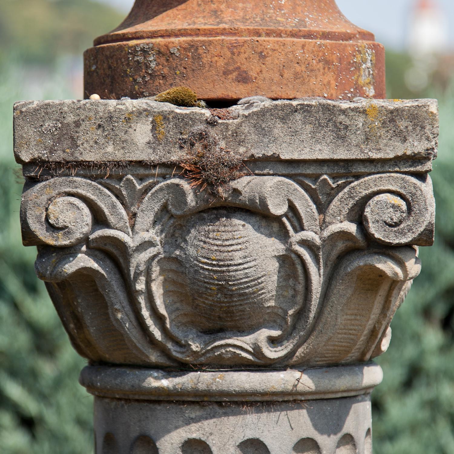 Pair of sandstone columns with fluted shafts and capitals decorated with volutes. Very beautiful natural patina.