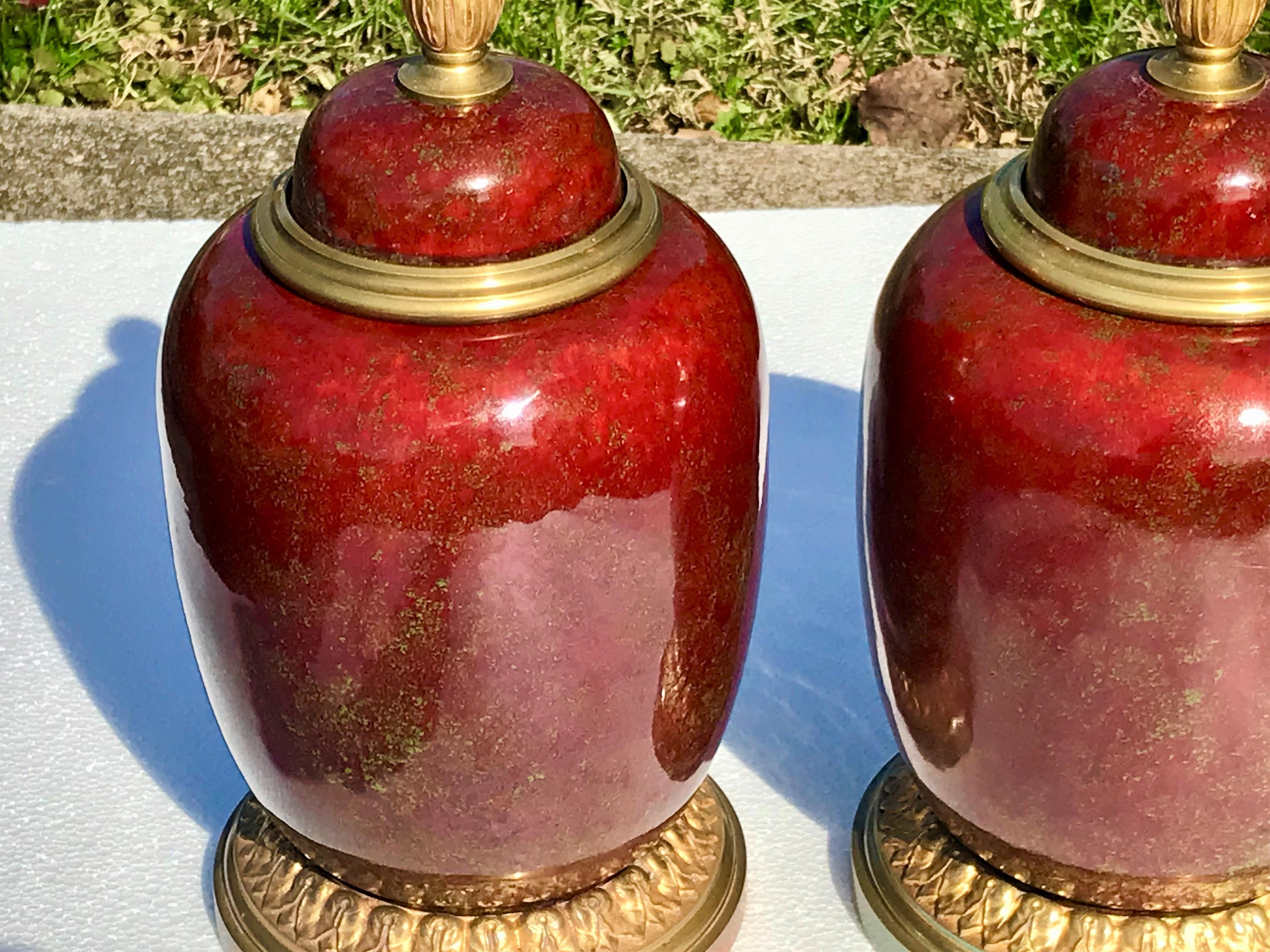 Pair of  Red Sang de Boeuf Flambé Bronze Mounted Sevres Styled Garniture  Urns In Fair Condition In Nashville, TN