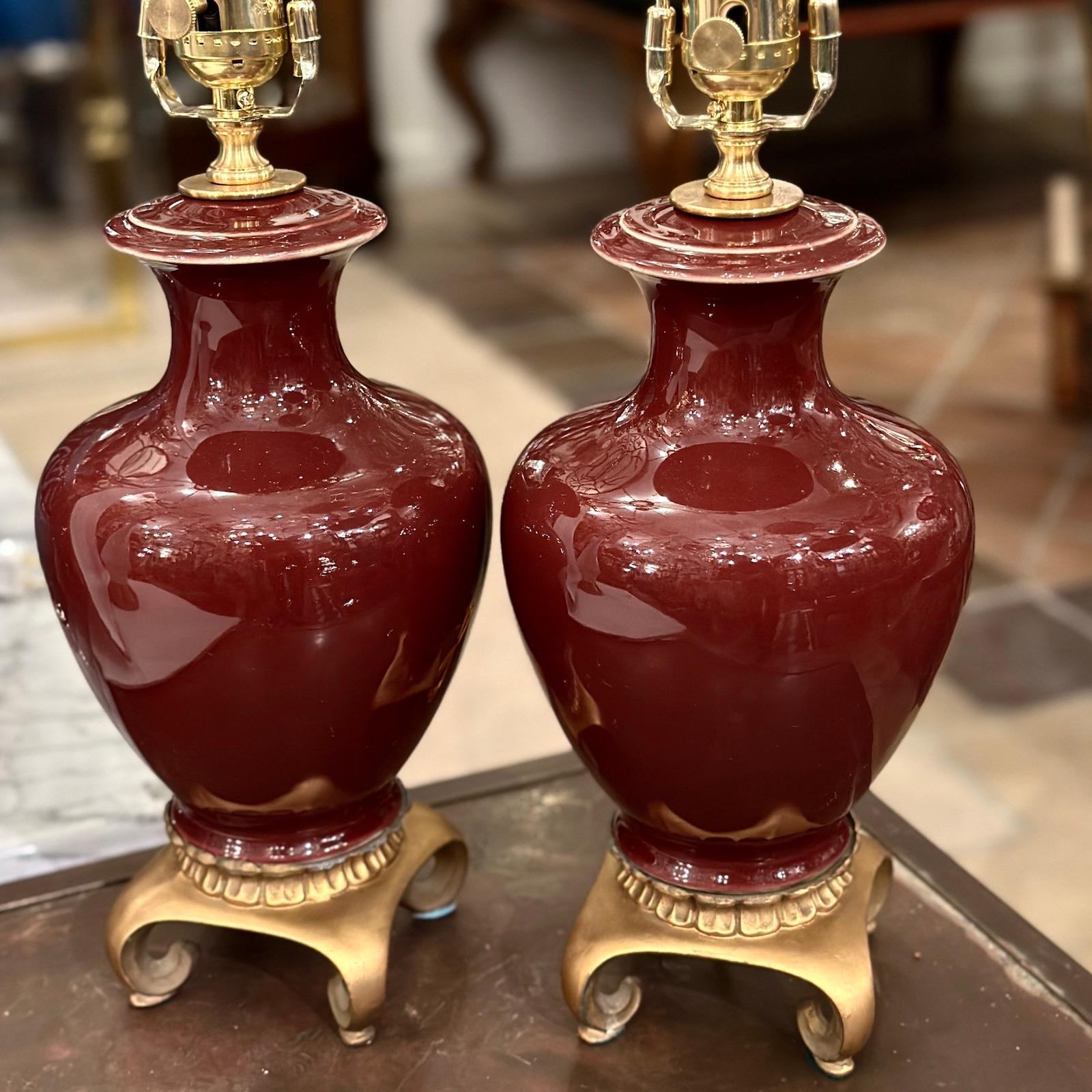 Pair of French circa 1920s porcelain table lamps with gilt bases.

Measurements:
Height of body: 12