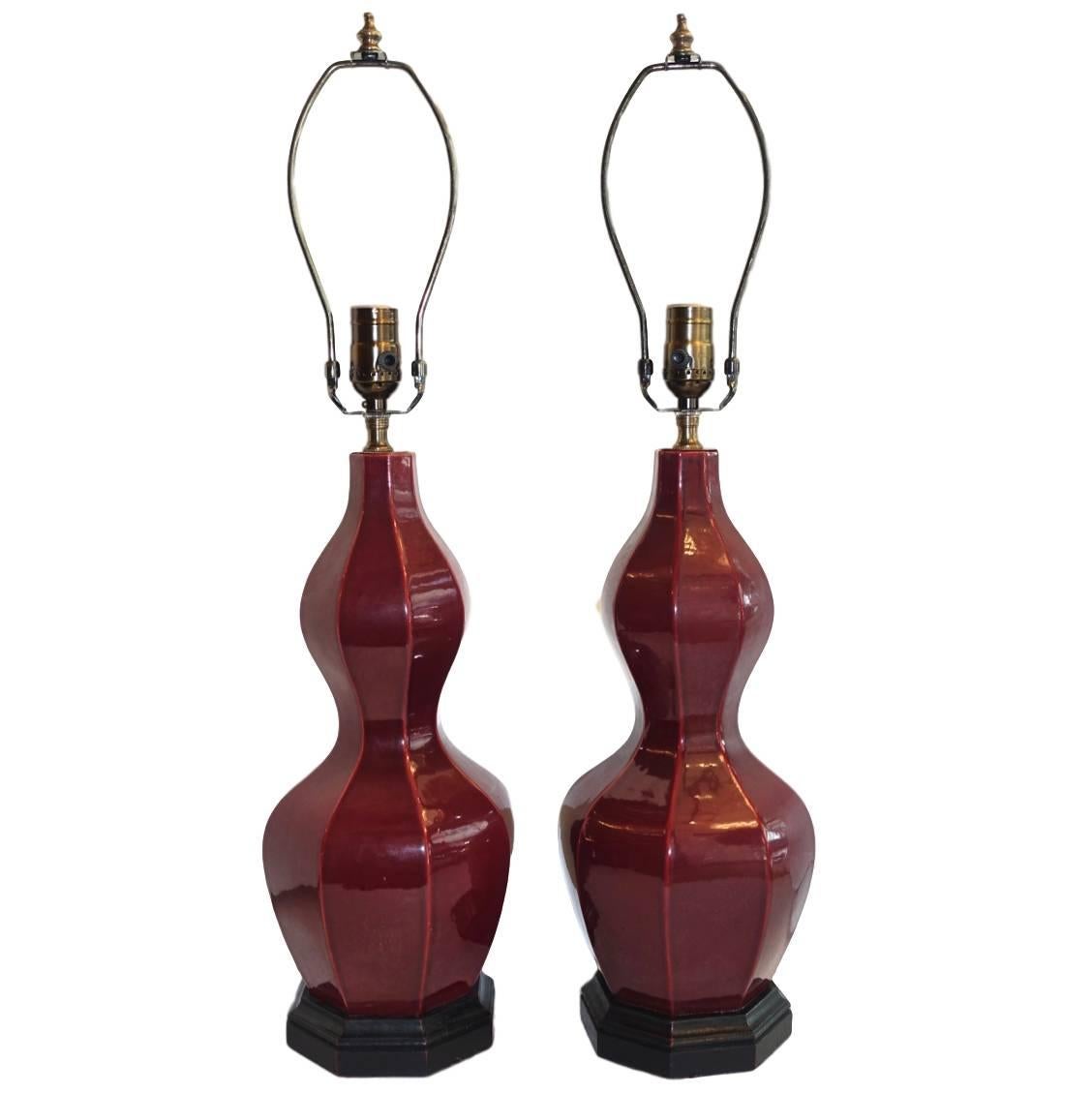 A pair of circa 1920s Chinese sang de boeuf table lamps.

Measurements:
Height of body: 17?
Height to shade rest: 26.5?