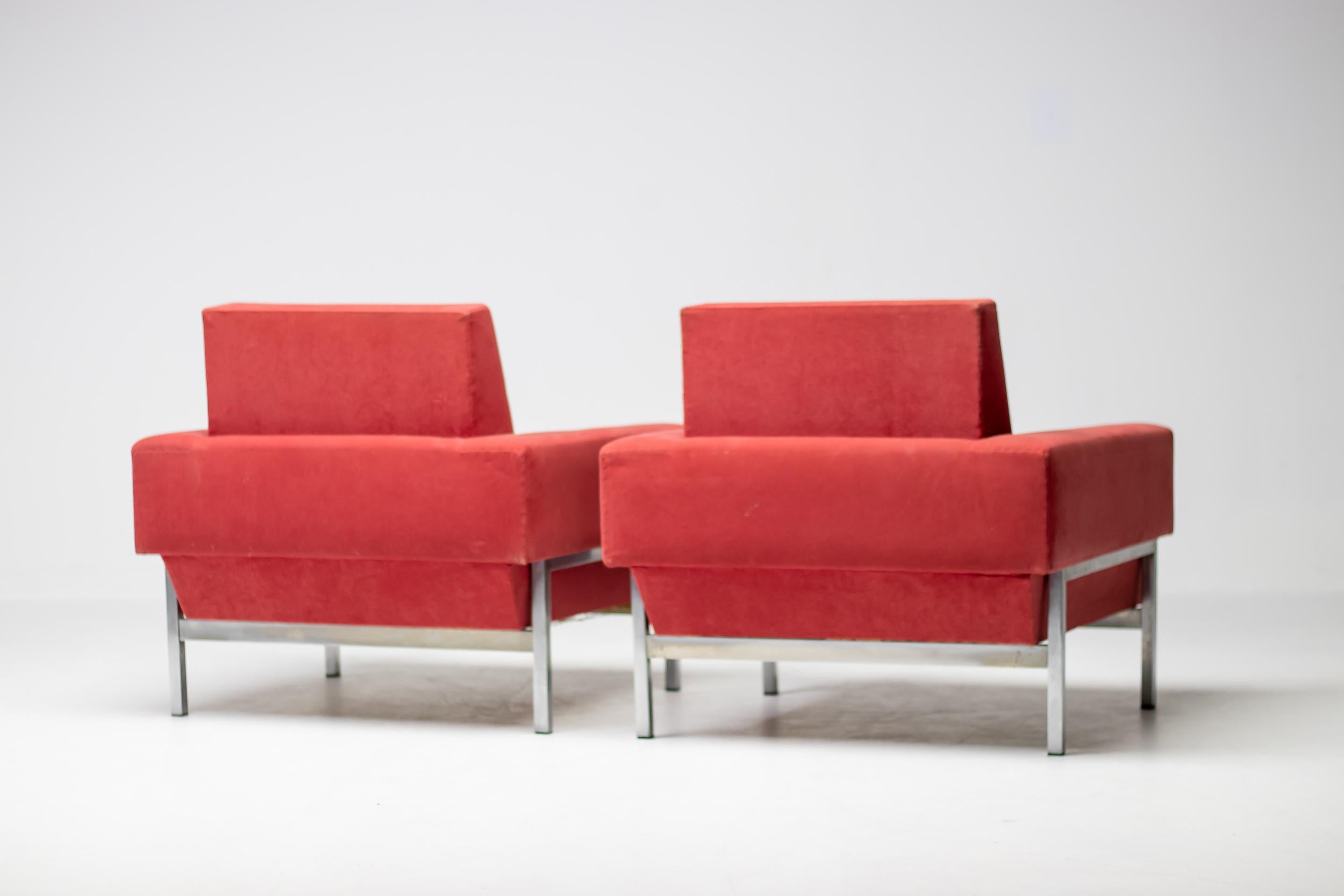 Kiushu club chairs in red Alcantara fabric, made in Italy circa 1960 by Saporiti. 
These chairs, equipped with a chromed steel frame, feature a very distinctive sloped back at the bottom. 
The chromed frame forms a wonderful contrast to the red