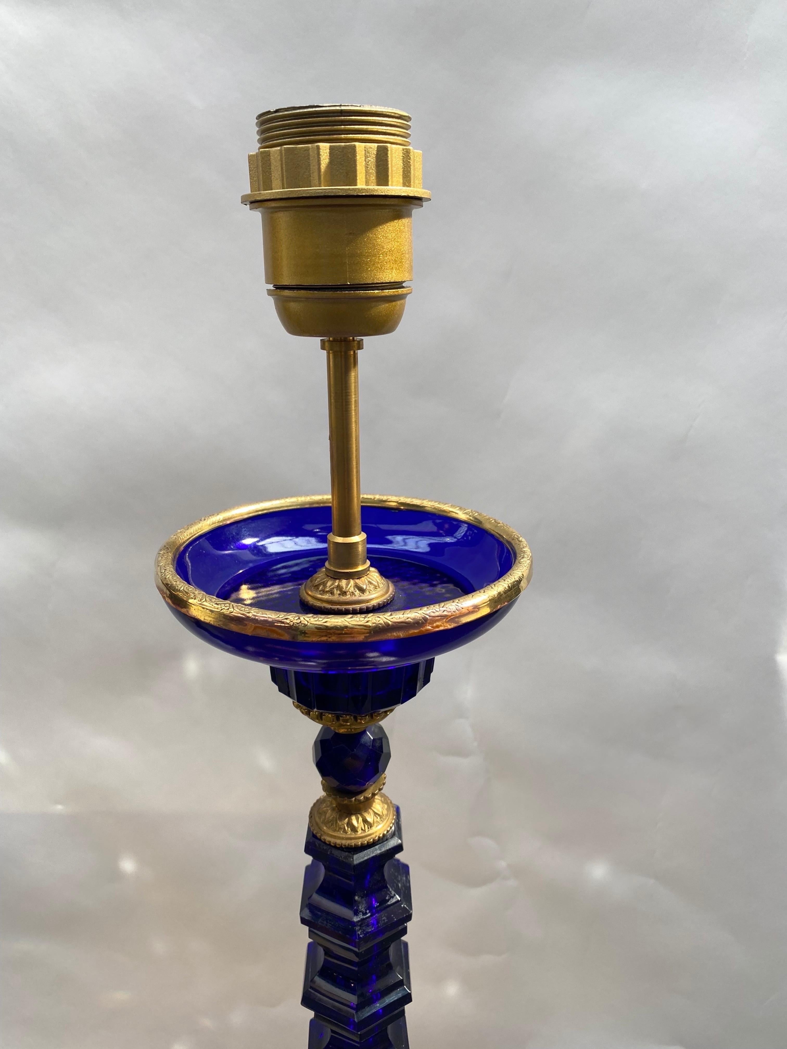 Pair of sapphire blue crystal lamp base gilded bronze. The crystal pieces are from the 40's, it come from one of the oldest glass houses in Paris, Maison König rue Pastourelle. Unfortunately, this house does not exist, but its crystals cut in
