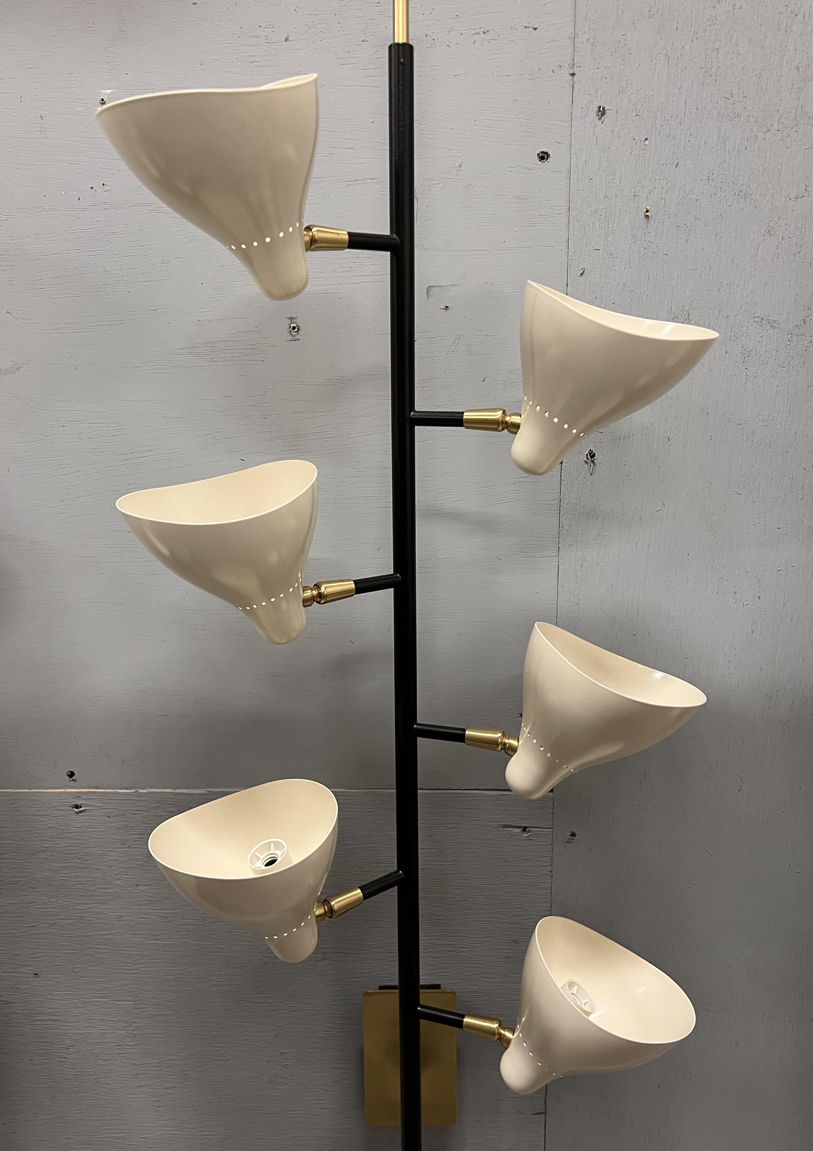 Pair of Italian Contemporary Sconces in the manner of Sarfatti
Completely handmade fixture of painted brass & painted aluminum shades. Each arm adjusts its positioning at the base & every shade pivots in different directions.
Not UL certified 