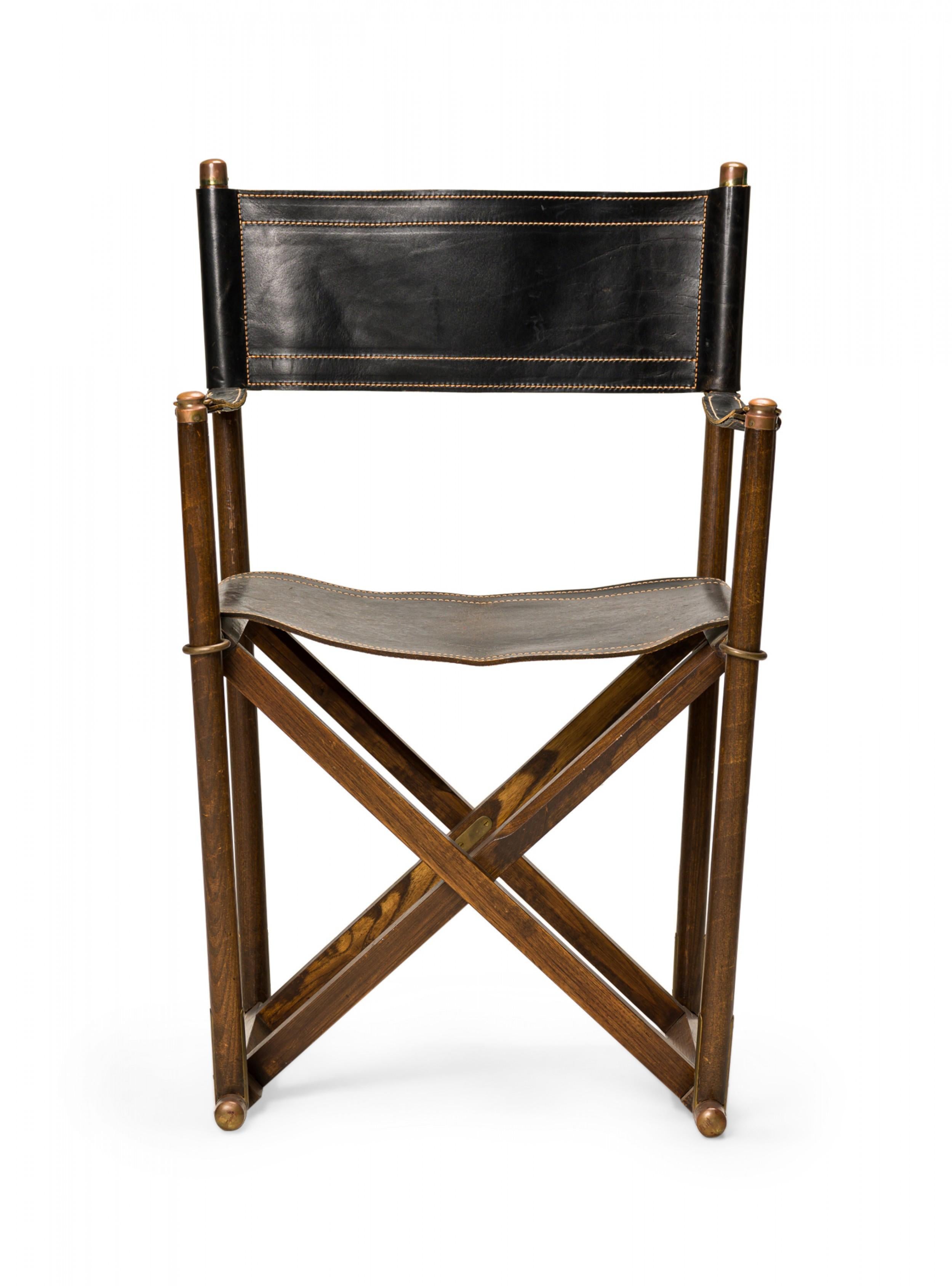 American Mid-Century folding campaign / director's chairs with walnut frames and black stitched leather sling backs, seats, and arms. (SARREID)(PRICED AS PAIR)
