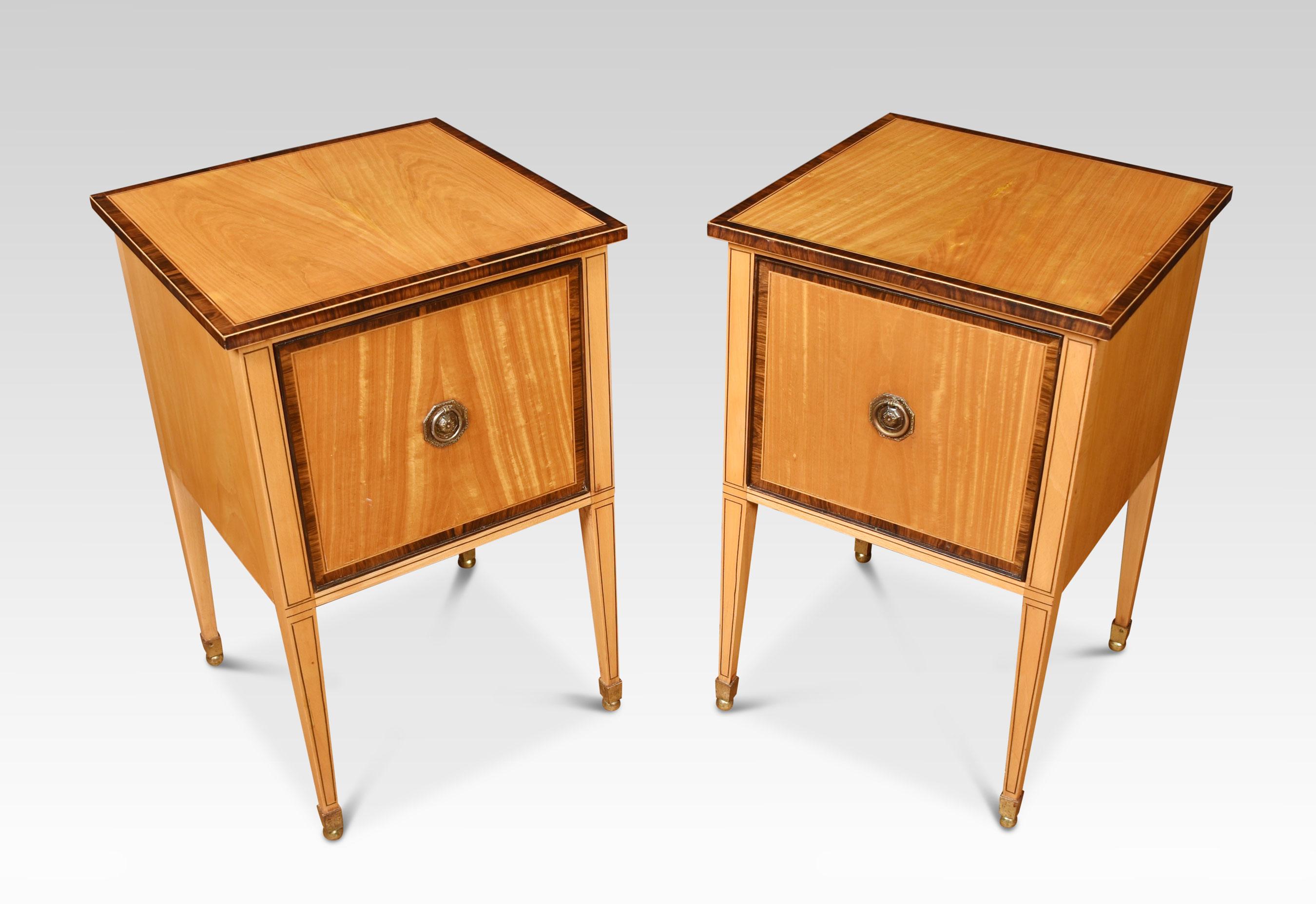 A pair of satinwood filing cabinets the square tops with a crossbanded edge above one large drawer with brass tooled handle. All raised on square tapering supports.
Dimensions
Height 27 inches
Width 18 inches
Depth 18 inches.
