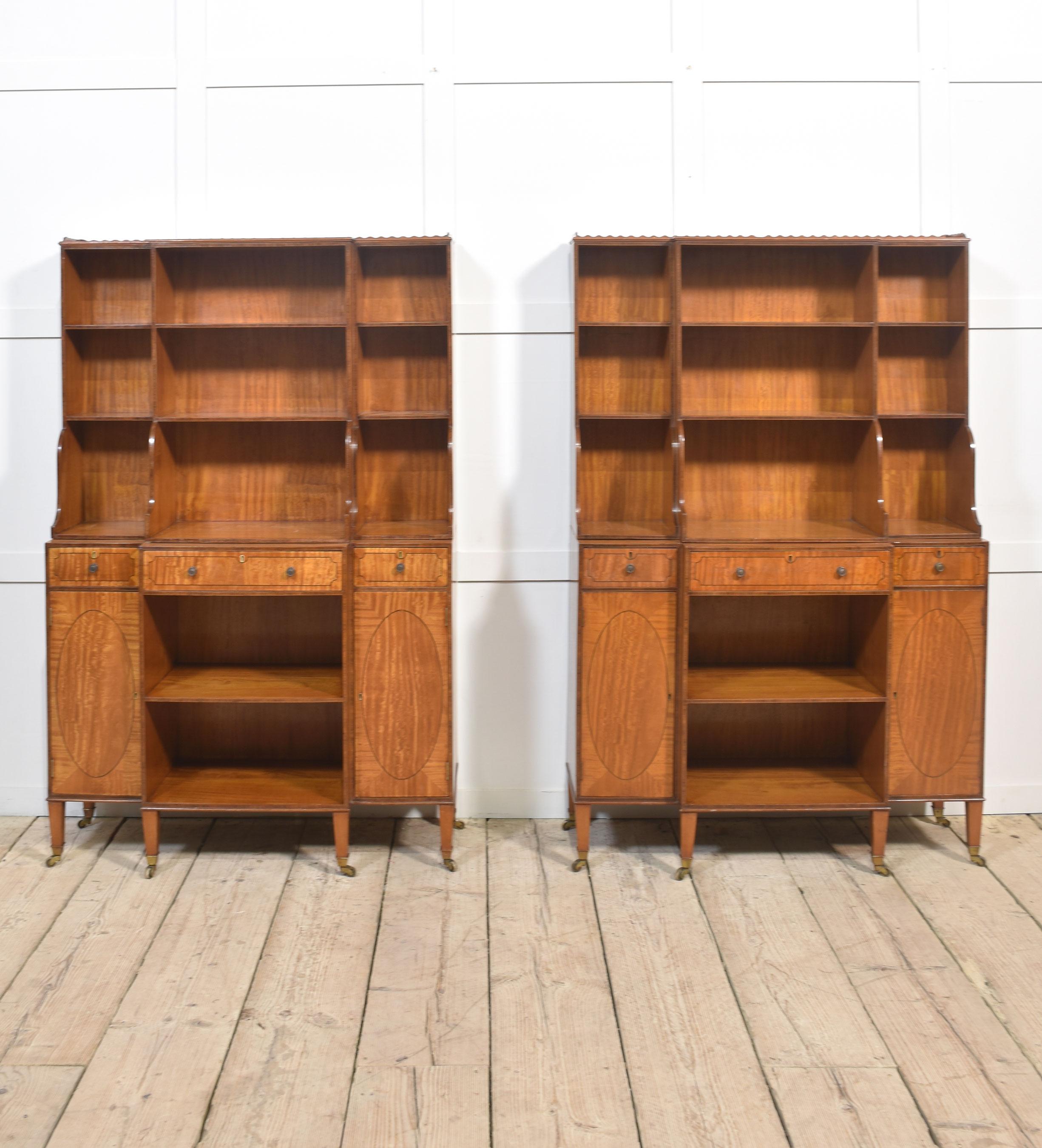20th Century Pair of satinwood crossbanded open breakfront waterfall bookcases For Sale