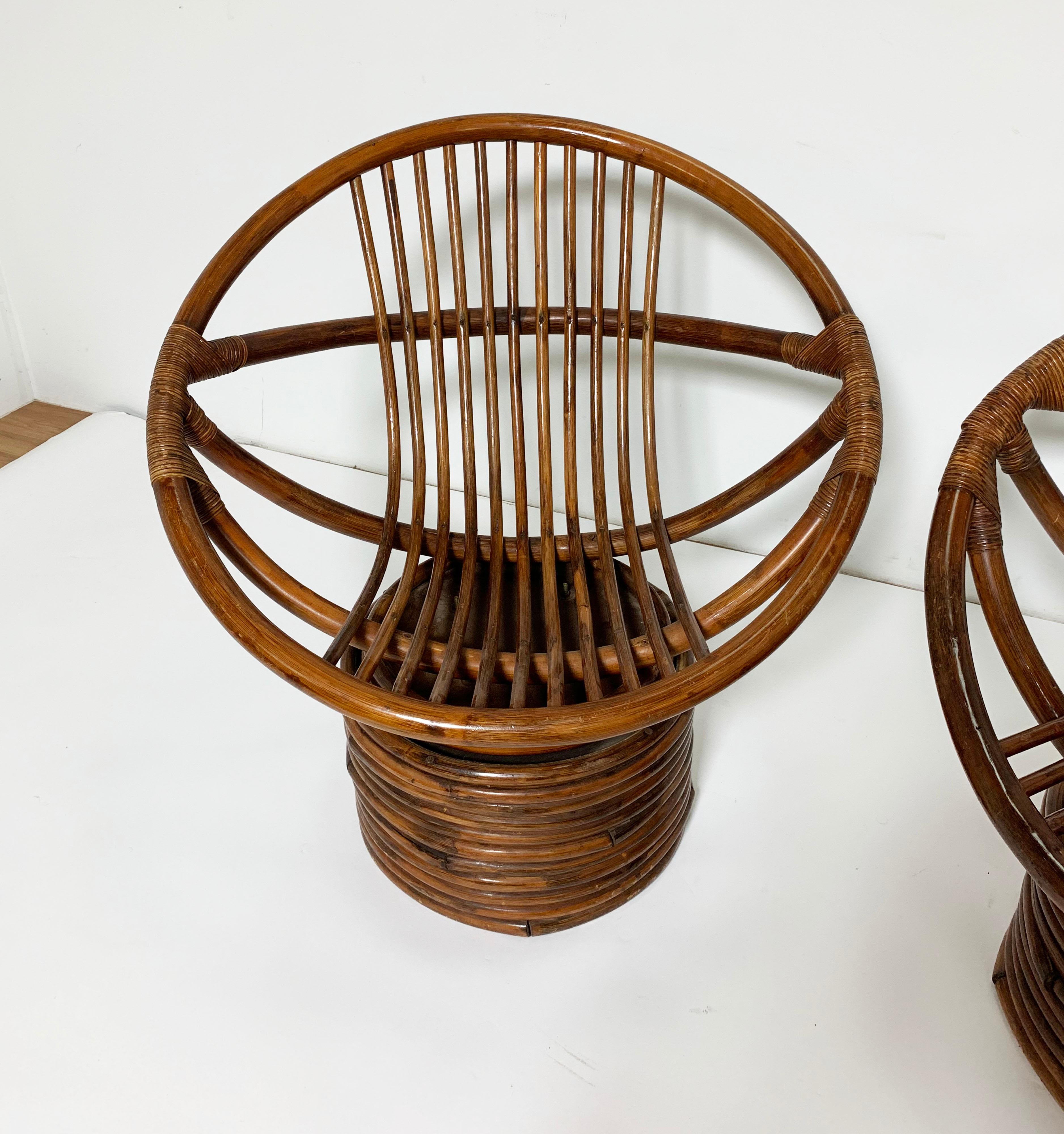 North American Pair of Saucer Form Swivel Lounge Rattan Chairs, circa 1960s