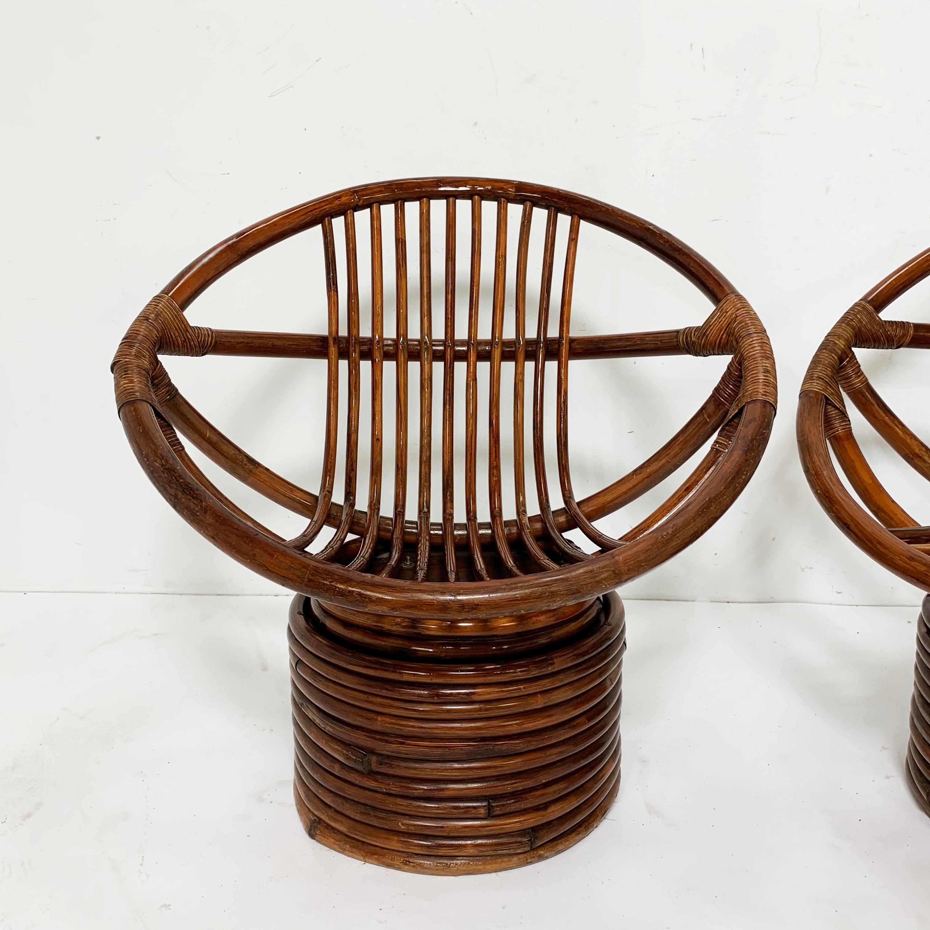 Cane Pair of Saucer Form Swivel Lounge Rattan Chairs, circa 1960s