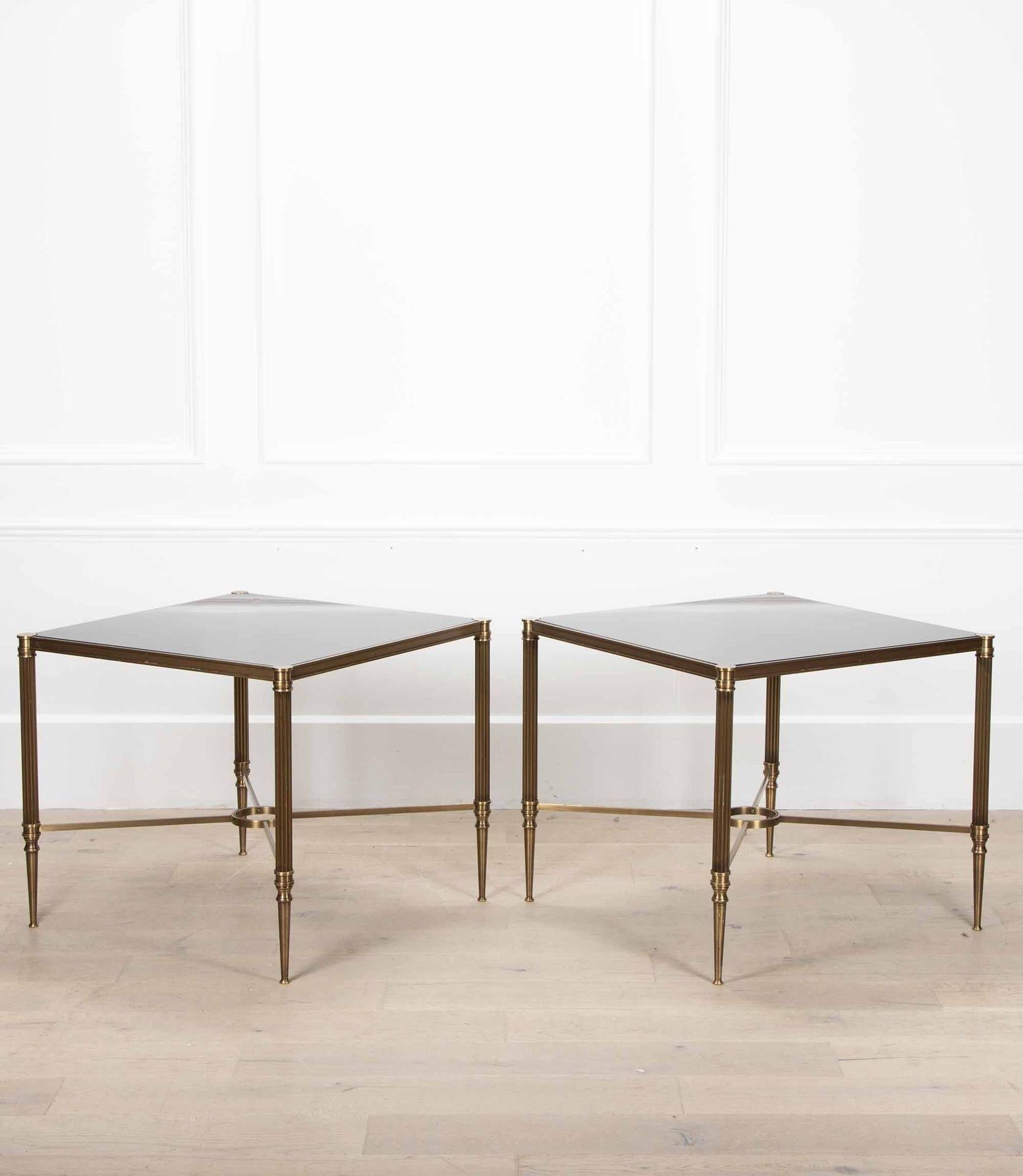 Pair of bronze side tables from the Savoy Hotel in London.

Of good scale & quality with black glass tops. Both are of strong and sturdy construction.

Circa 1960s.