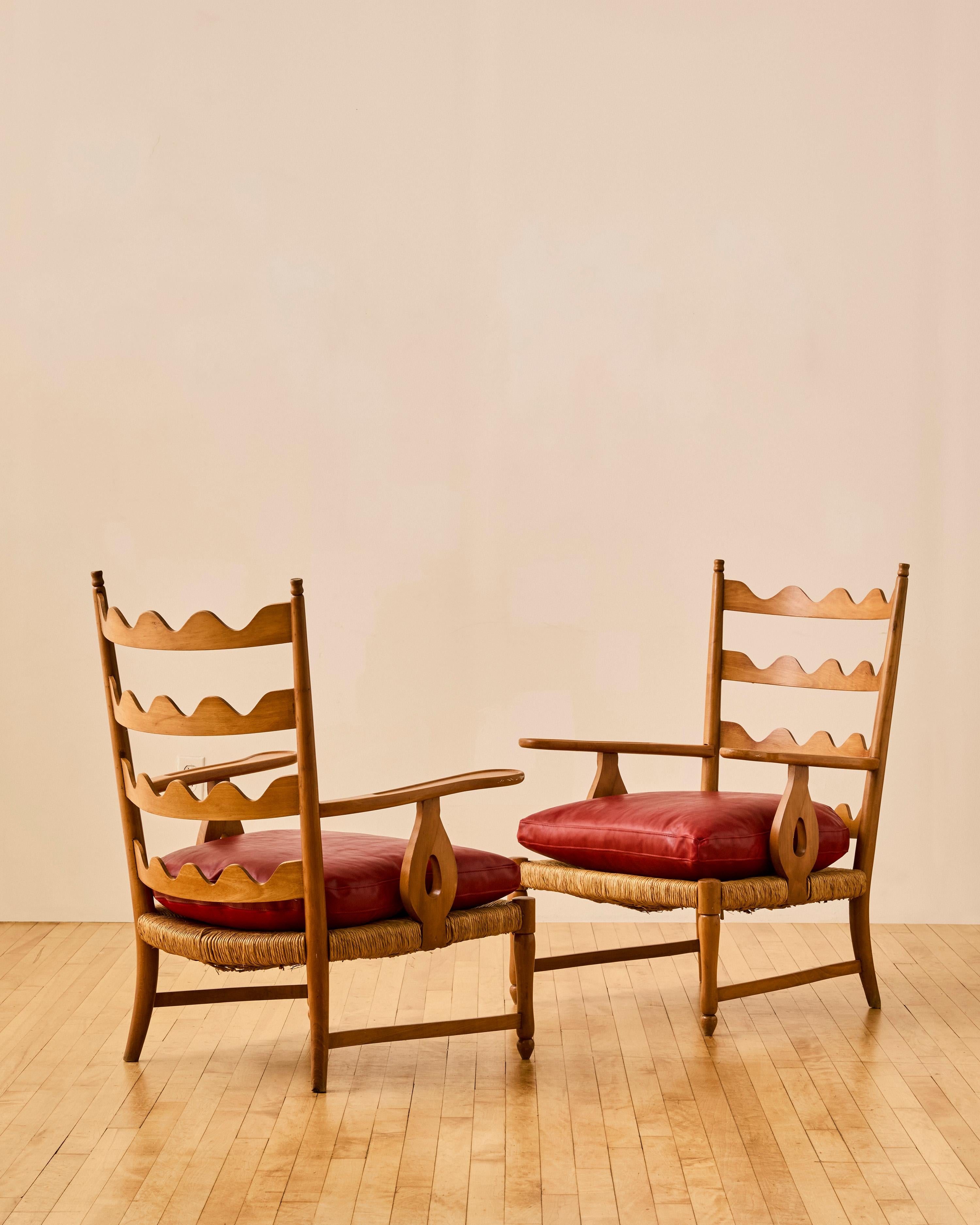 Pair of scallop back armchairs by Paolo Buffa with execution by Serafino Arrighi c. 1950. Features newly upholstered removable red leather seat and back cushions. 