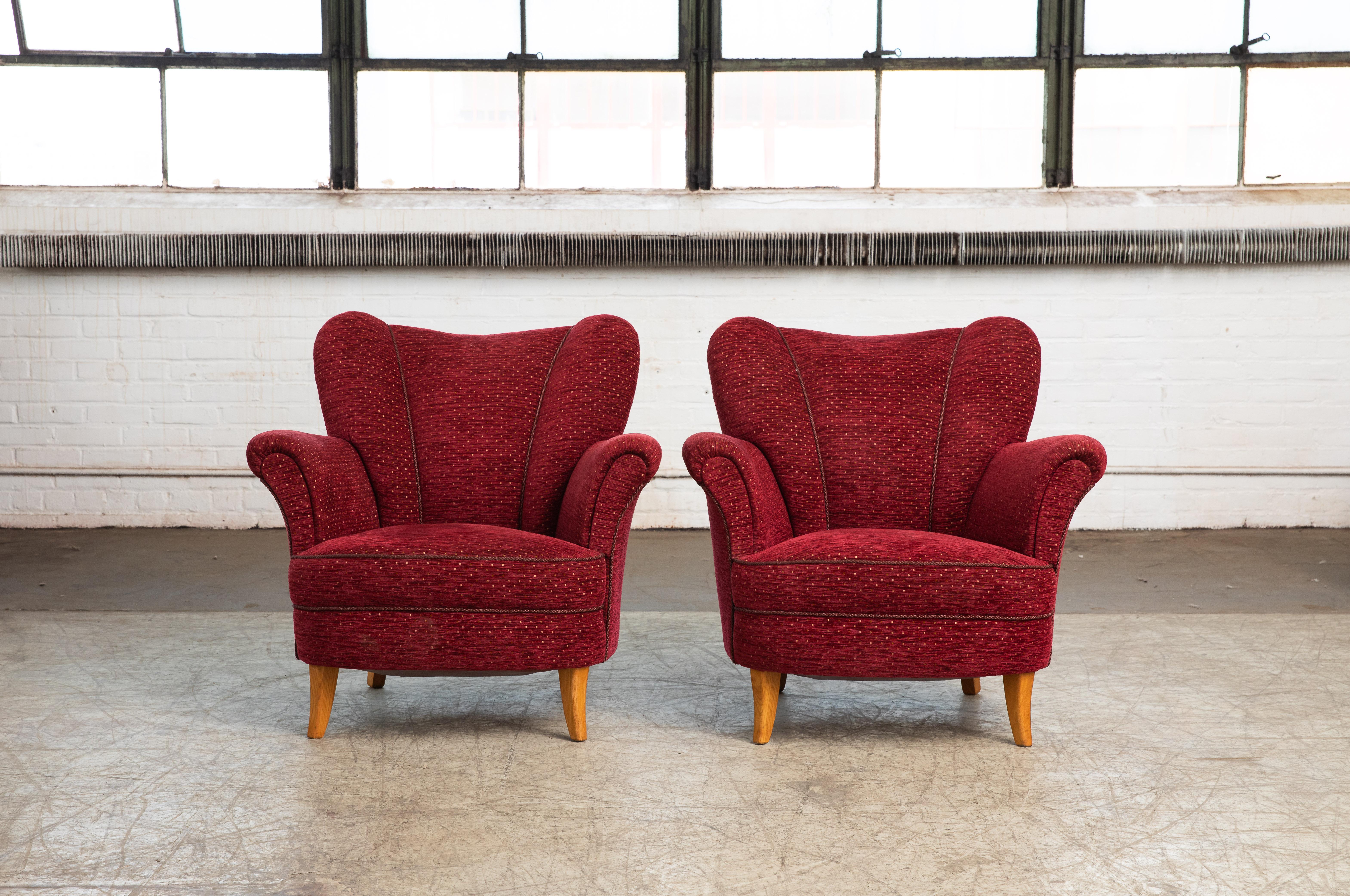 Beautiful pair of 1940s Scandinavian easy chairs in the style of Finnish Design Icon, Carl-Johan Boman. Very elegant with their distinct shape, precise lines and harmonious proportions. While we found these chairs in Denmark the style is more