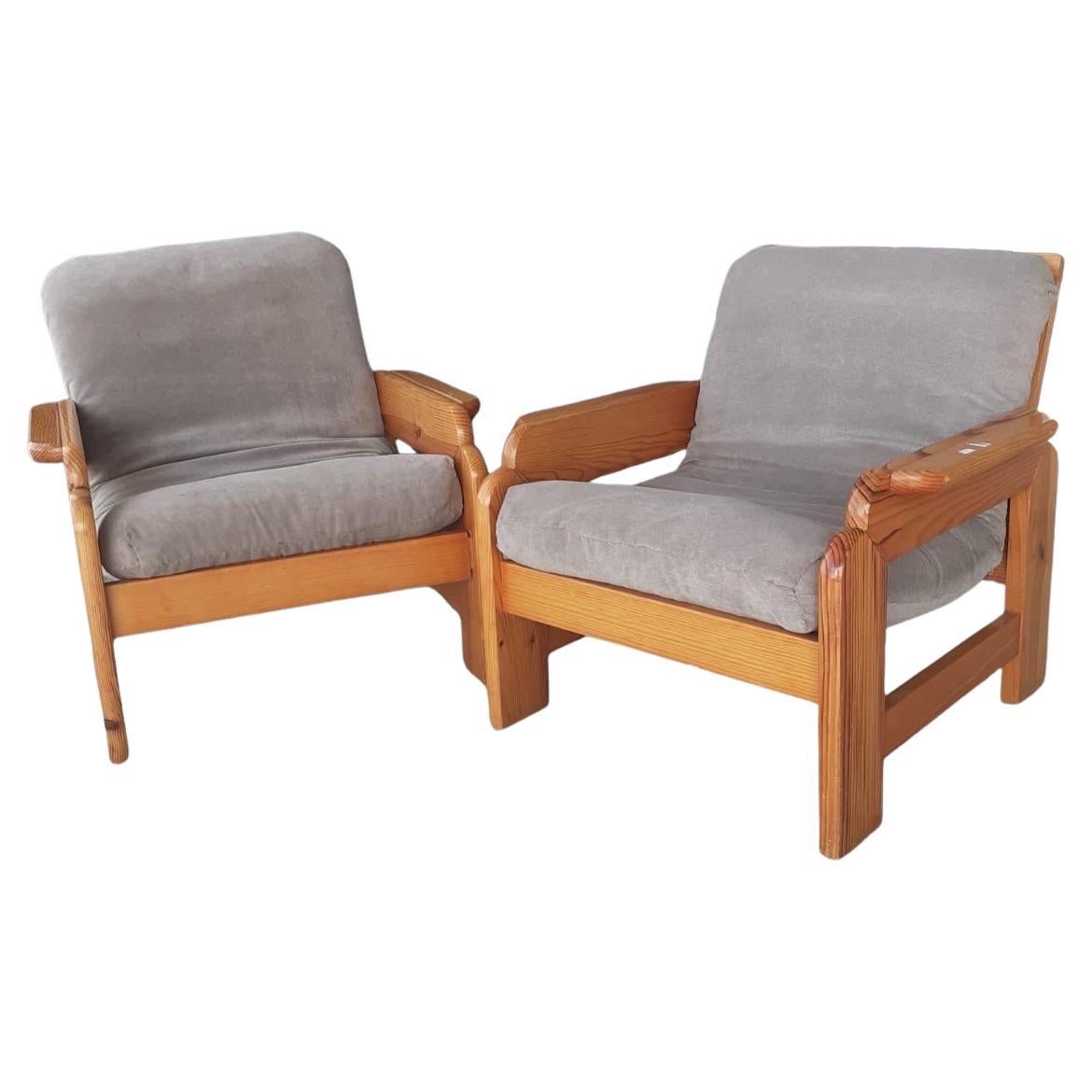 A scandinavian pair of pine and fabric armchairs circa 1970