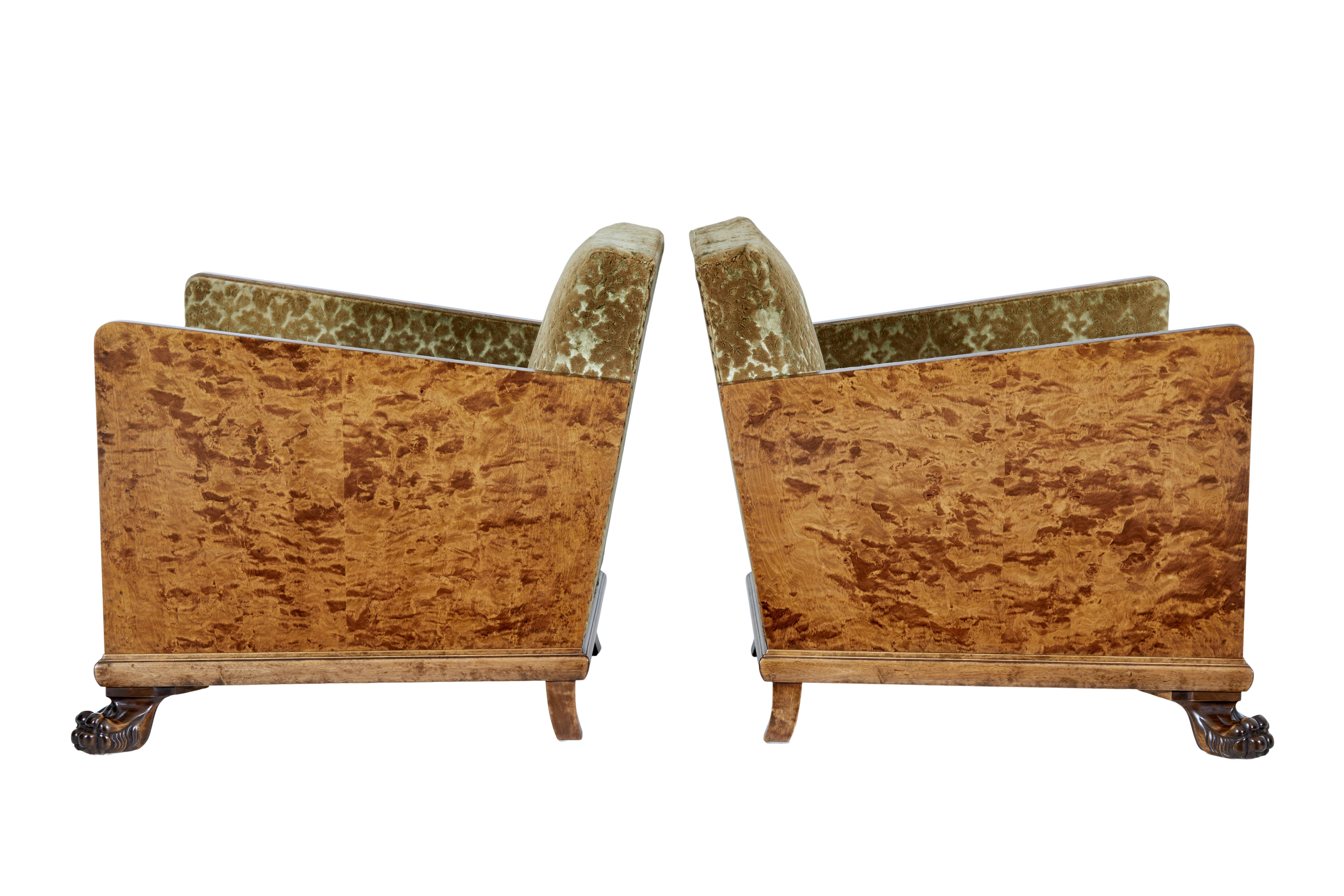 Pair of Scandinavian Art Deco birch club armchairs, circa 1930.

Stunning pair of Art Deco period armchairs from Sweden. Sides and arms veneered in a figured birch which gives its striking appearance. Standing on front carved lion paws feet, with