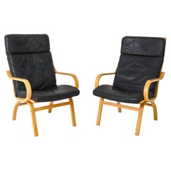Pair of Scandinavian black Leather and Curved Beech wood lounge chairs