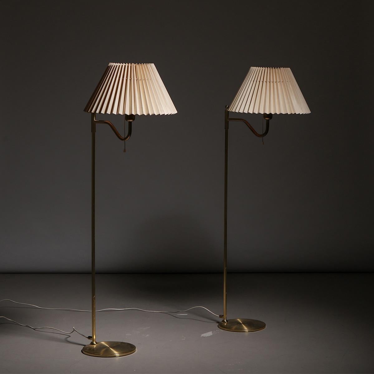 Pair of Scandinavian brass floor lamps, made in Sweden, 1960s.
The lamps feature the original manufacturer’s stamp.

Date of manufacture: 1960s
Origin: Sweden
Material: brass, fabric shades
Dimensions: H 115 cm x W 40 cm x D 50 cm
Condition: in
