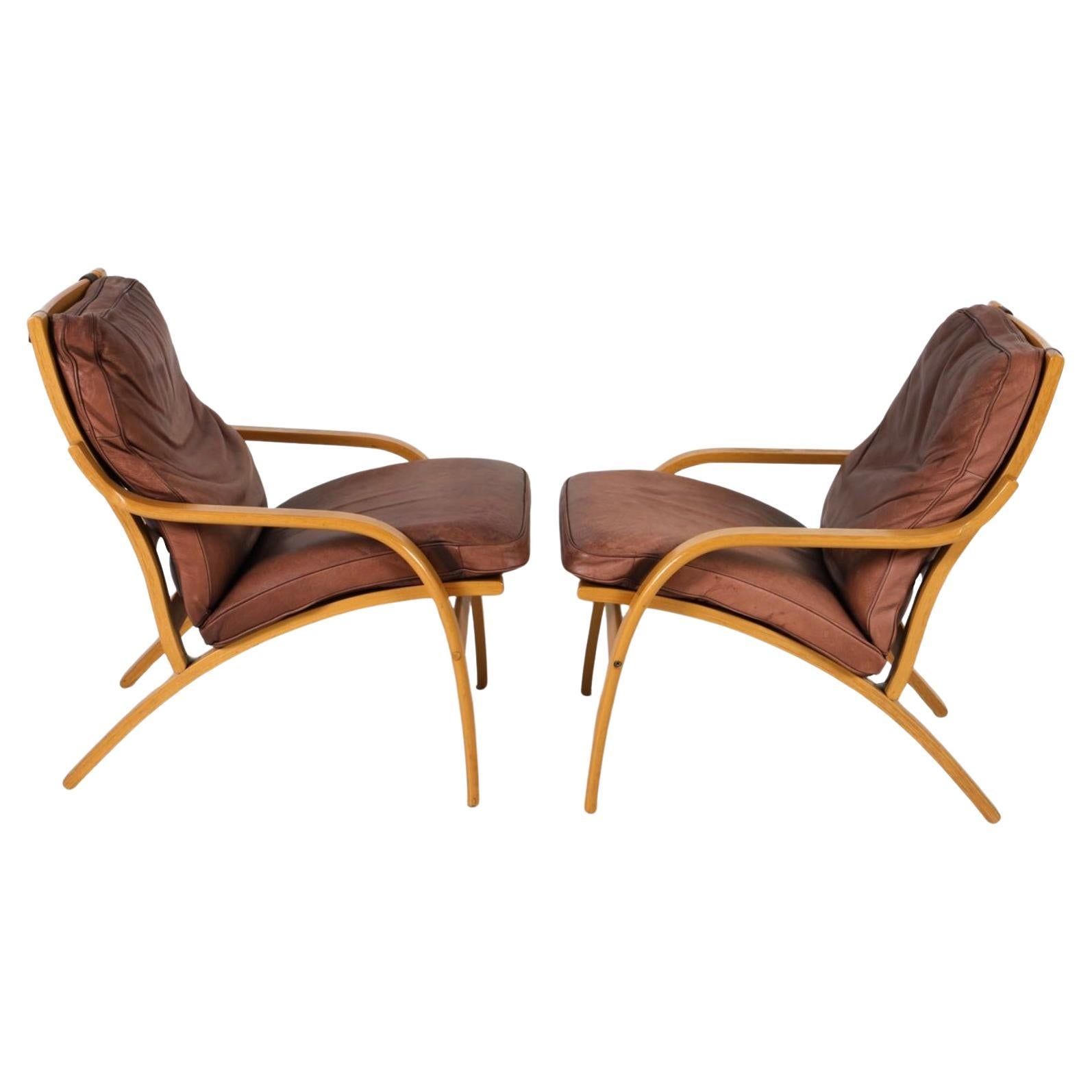 Scandinavian Modern Pair of Scandinavian Brown Leather and Curved Beech wood lounge chairs For Sale