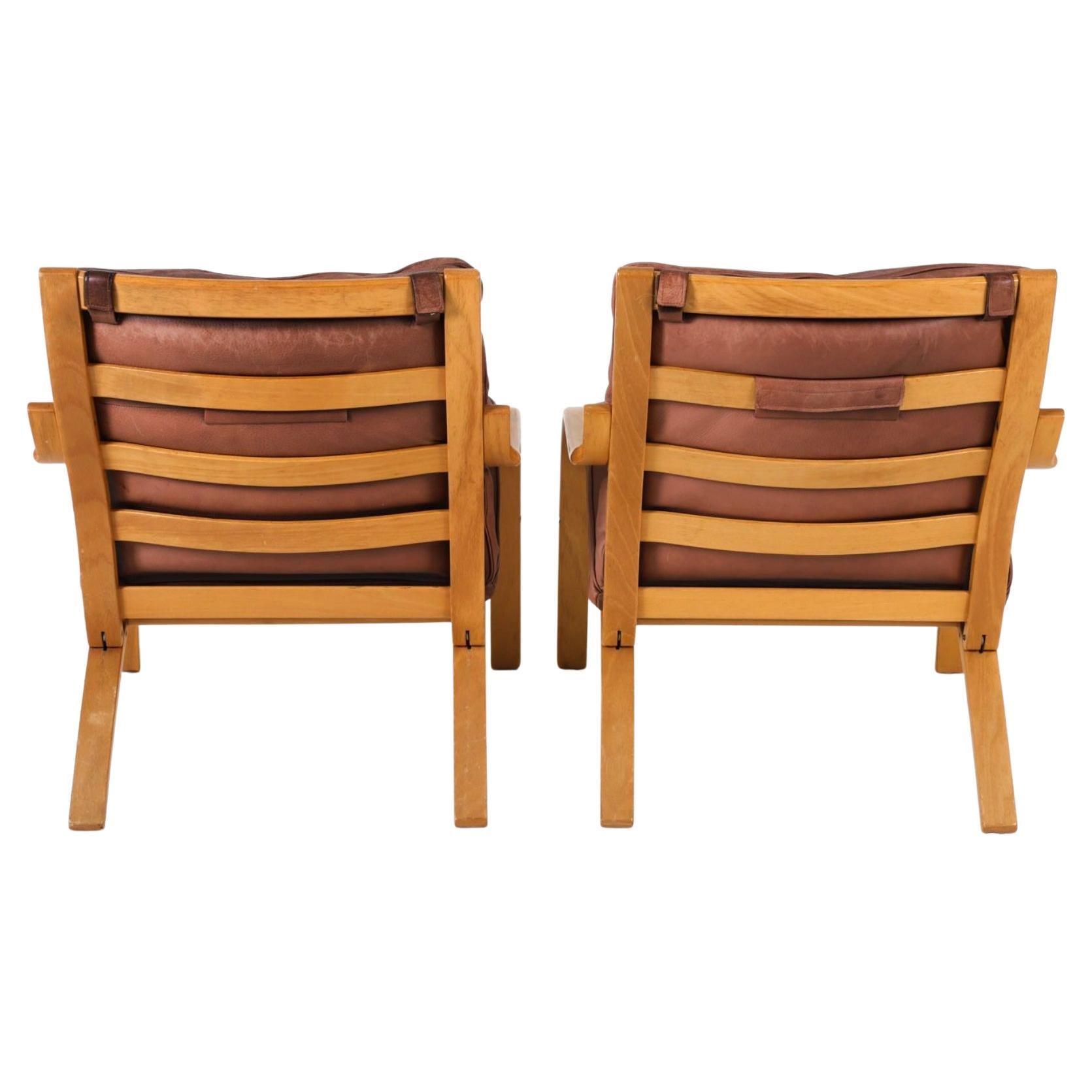 Woodwork Pair of Scandinavian Brown Leather and Curved Beech wood lounge chairs For Sale