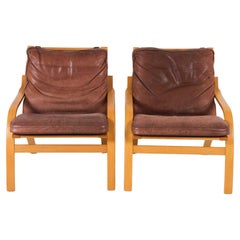 Pair of Scandinavian Brown Leather and Curved Beech wood lounge chairs