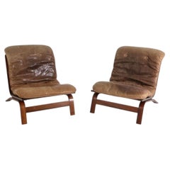 Pair of Scandinavian Brown Leather and Curved Rosewood low lounge chairs