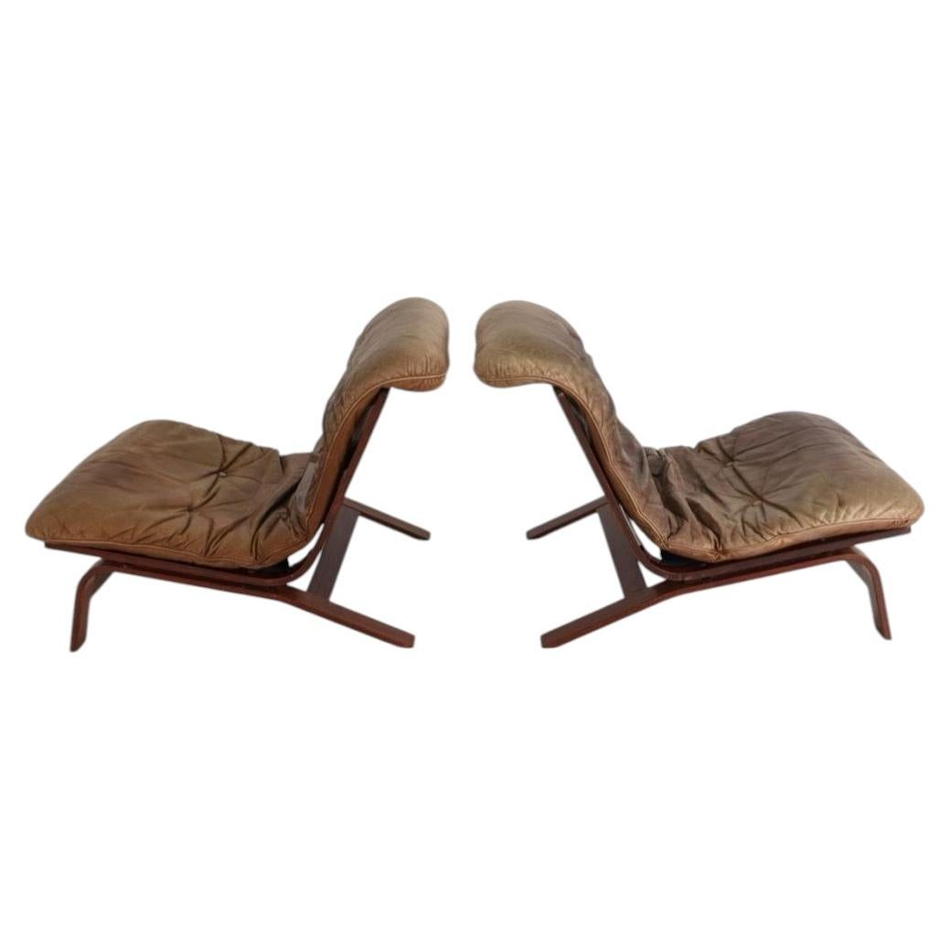 Pair of Scandinavian Brown Leather and Curved Rosewood low lounge chairs